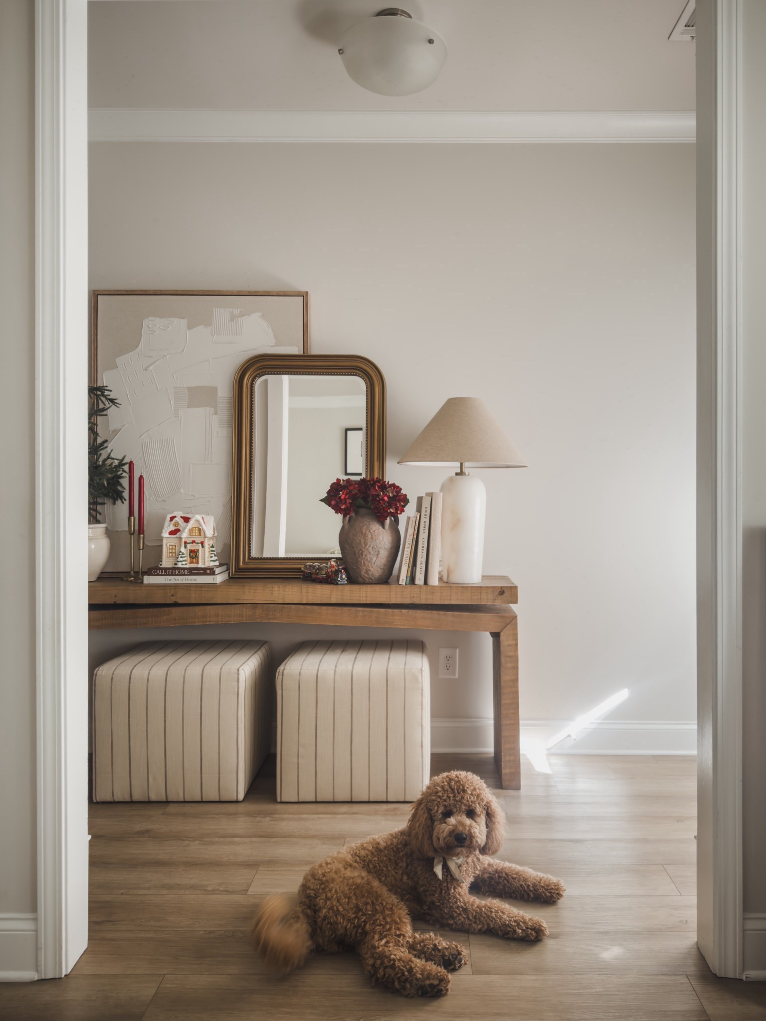 Light and bright front entry way styled for the holidays with neutral art, pops of deep red and collected Christmas finds from EBay. 

Wayfair finds, furniture faves, pottery barn, Amazon home decor, front entry, striped ottomans, joss and main, shop the look! #LTKStyleTip

#LTKSeasonal #LTKSaleAlert
