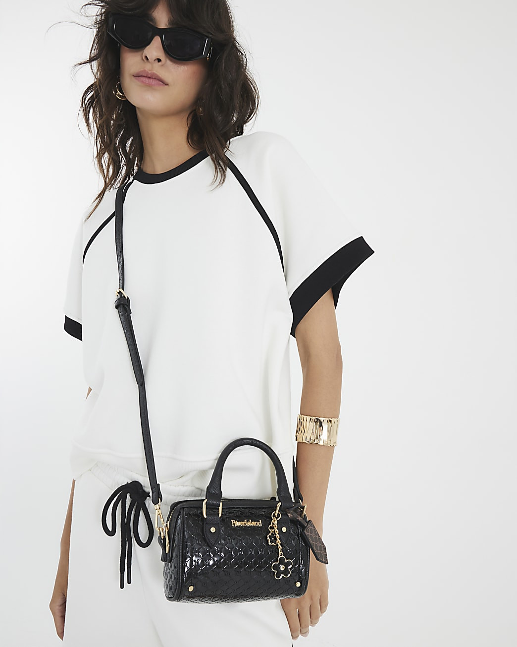Black embossed bowler mini cross body bag | River Island UK & IE