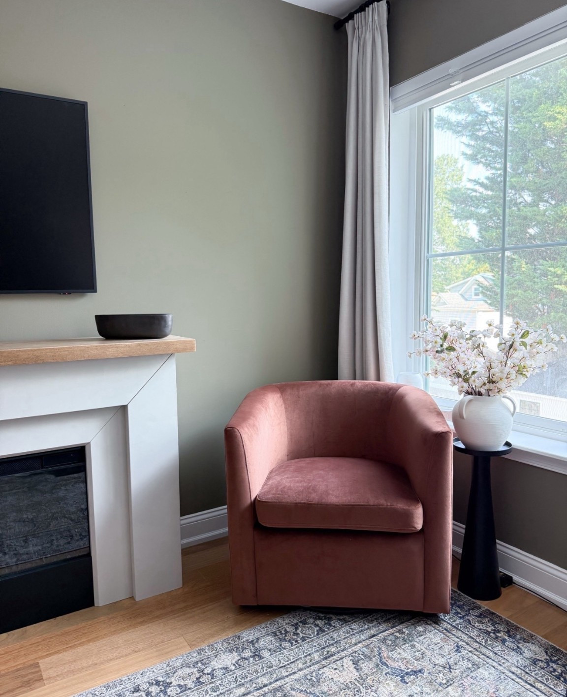 This corner features a blush velvet swivel chair from Target. I topped it with faux stems in a matte white vase for contrast and height. Perfect cozy corner for reading or morning coffee with a view.

#LTKOver40 #LTKStyleTip #LTKHome