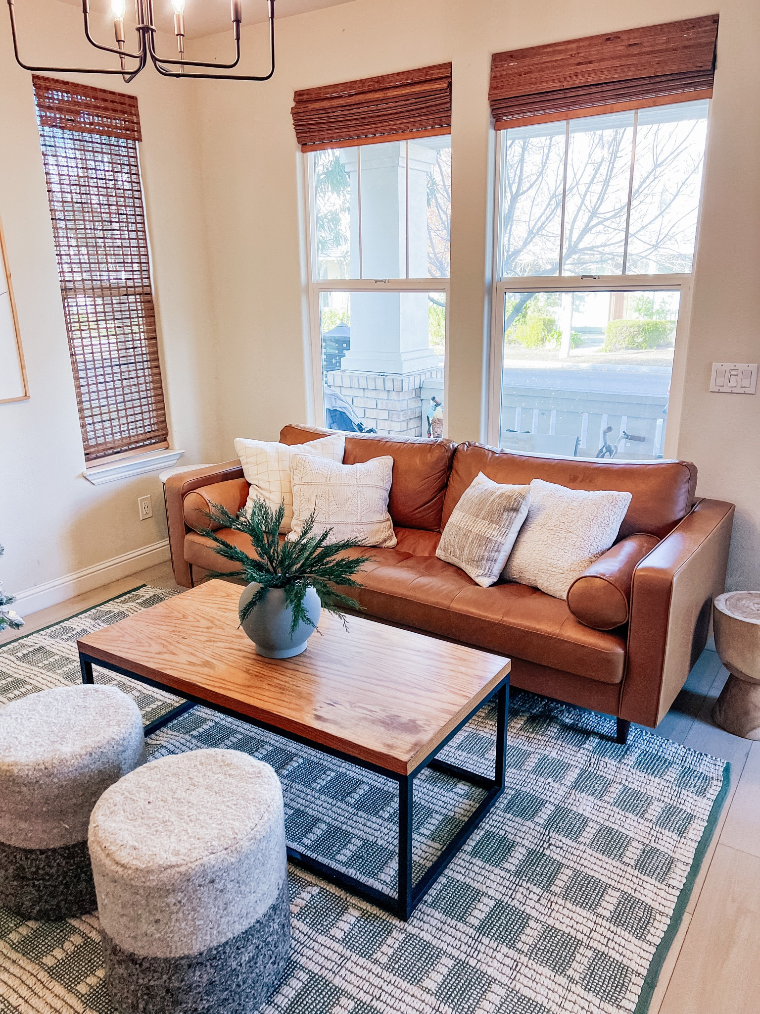 Living room decor. Sherpa throw pillows, vase, ottoman/poufs, coffee table 

#LTKhome