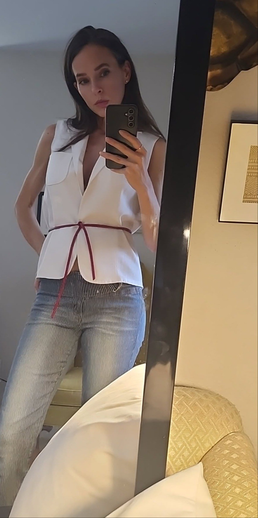 Style inspiration. Thin red leather belt. Waist tie belt. Cord belt. White vest. Linen vest. Amazon find. Amazon fashion. Striped denim. Flared denim. Straight denim. Wide leg denim. Jeans. Railroad stripe jeans. 

#LTKootd #LTKSeasonal #LTKSaleAlert