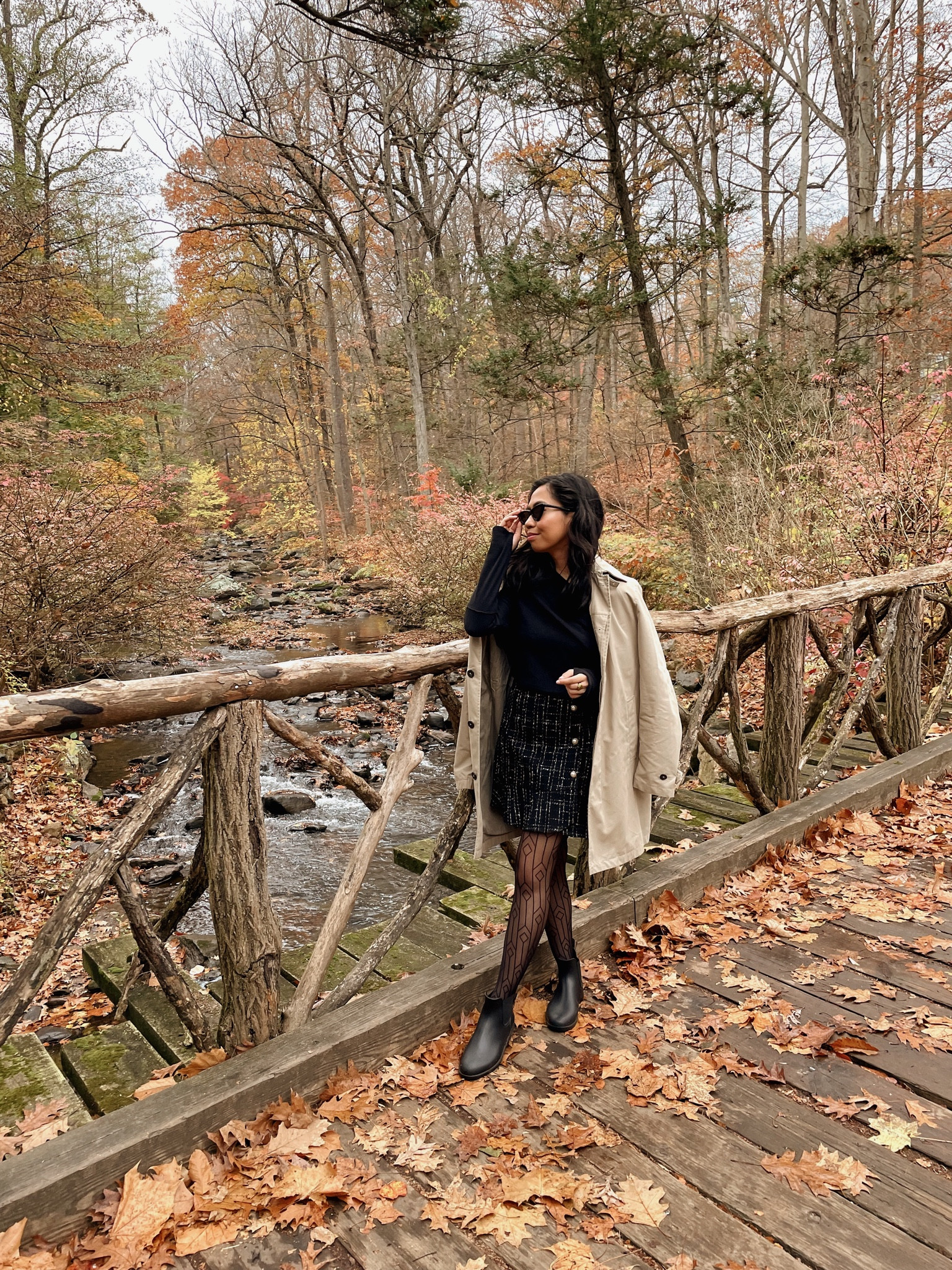 Wearing an all black outfit doesn’t need to be boring 😉 I love wearing a trench coat over this over the shoulder sweater and mini tweed skirt 💕 I love pairing this look with black tights and ankle booties! 

#LTKSeasonal #LTKunder100 #LTKstyletip