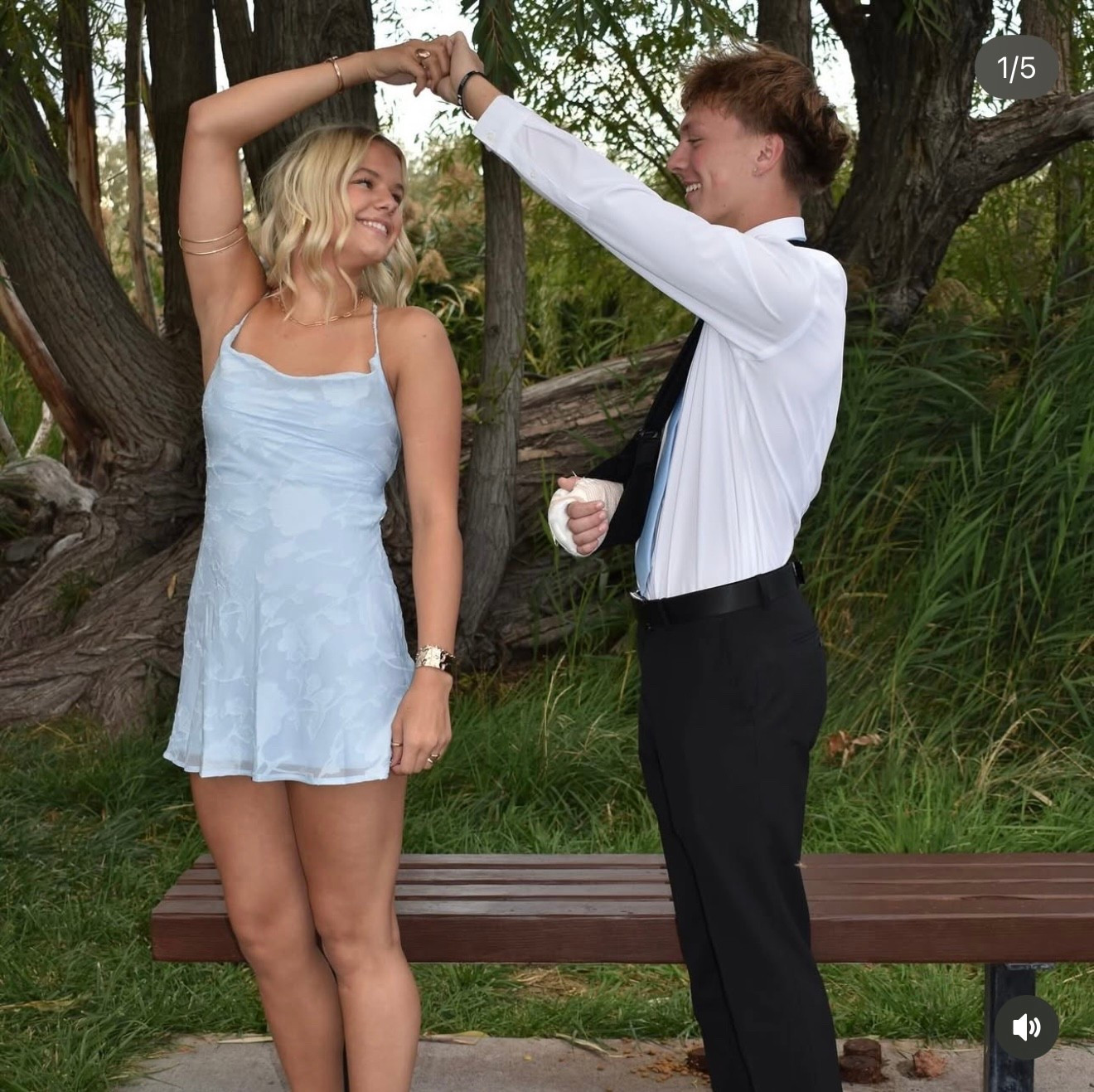 Homecoming dress. 
Cowl open back Mini dress
Floral detail, invisible zipper on side, exposed back with cross tie detail
Non-stretch material, fully lined
Main: 100% polyester, Lining: 100% polyester
Cold hand wash