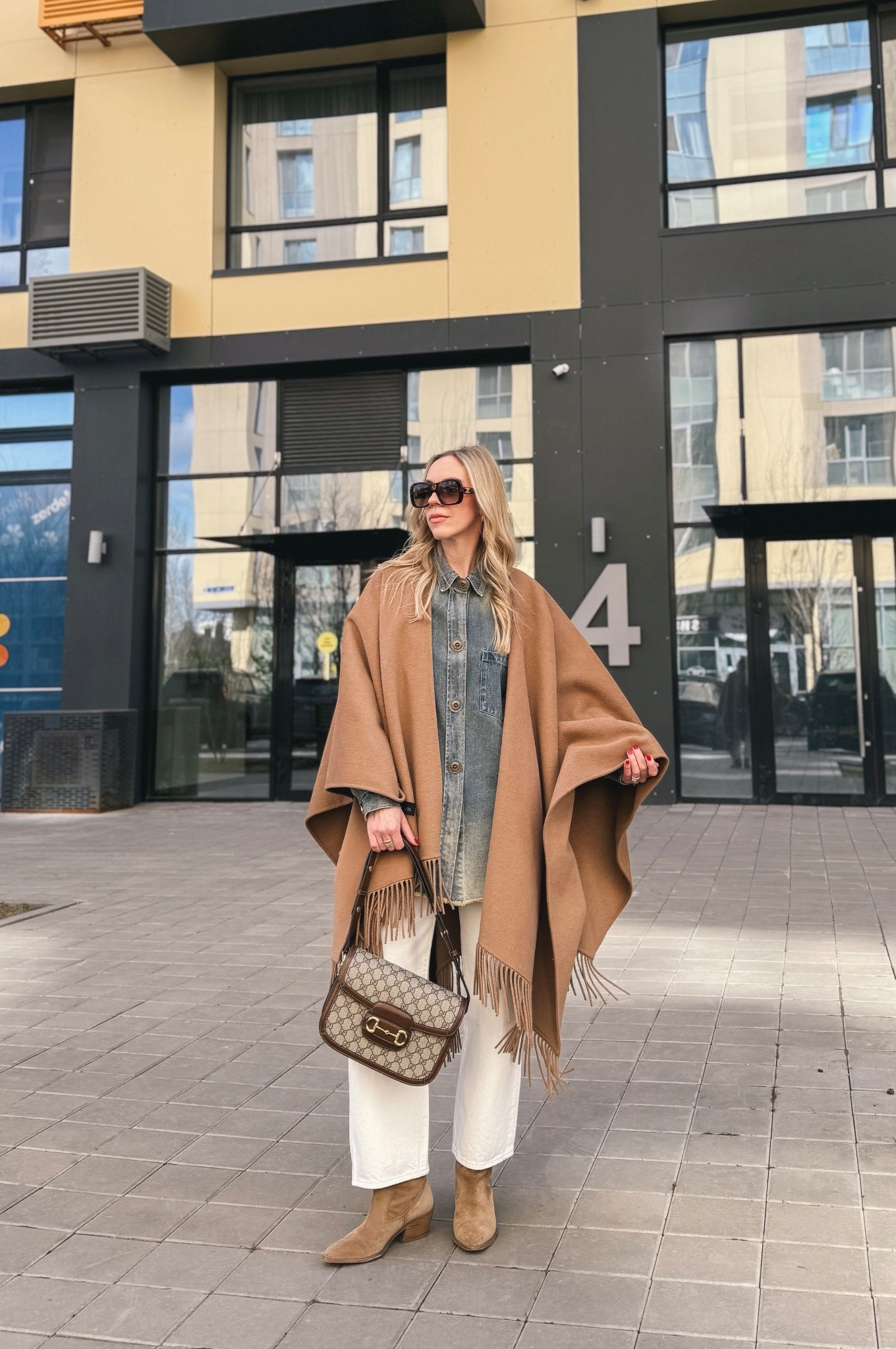 Spring outfit, camel cape, poncho, denim shirt, denim on denim, @levi white 90’s ankle jeans, cowboy boots

#LTKSeasonal #LTKSaleAlert #LTKOver40