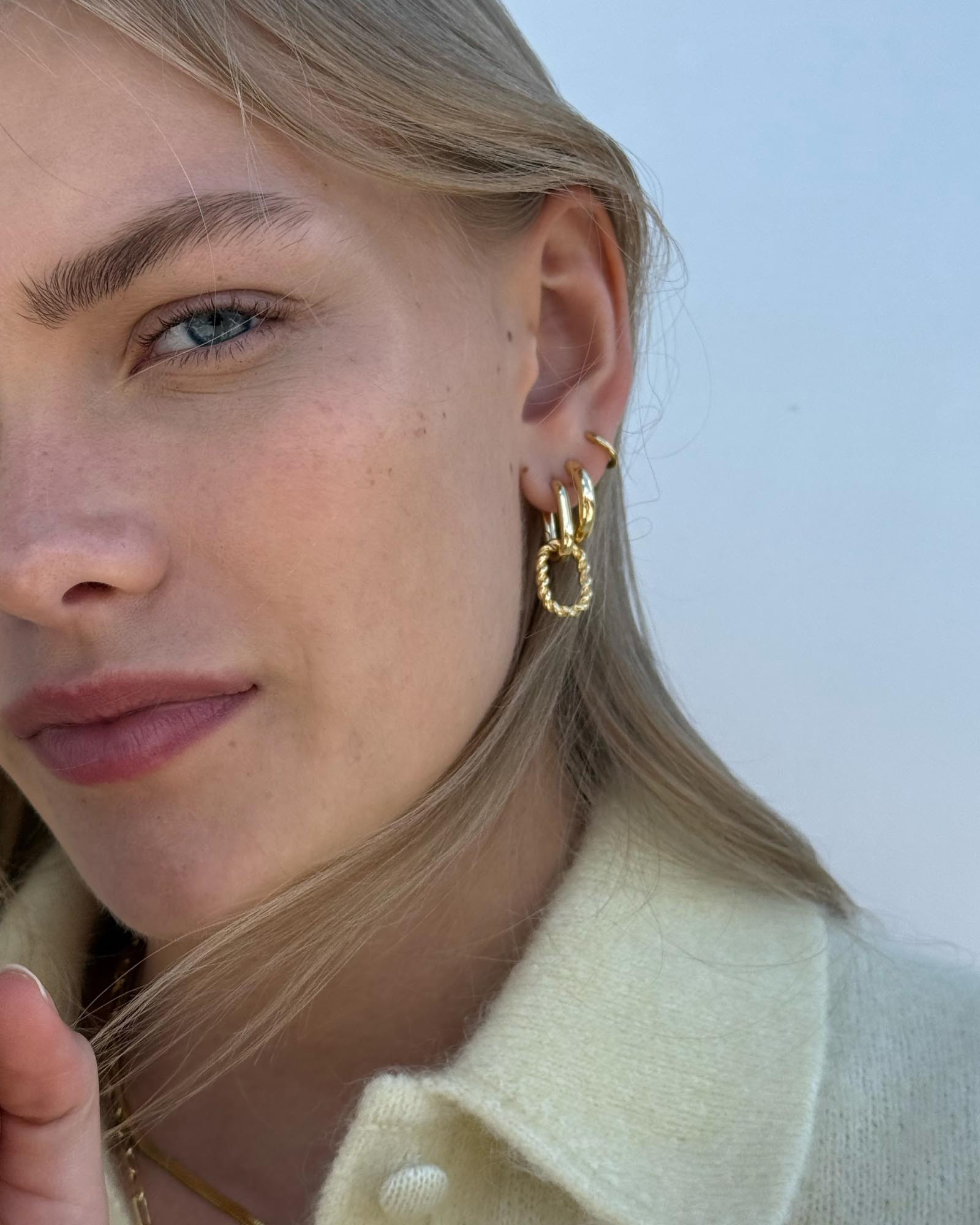 Chunky yet chic, these gold hoop earrings plated in 14k gold feature a shiny polished finish that... | Ana Luisa