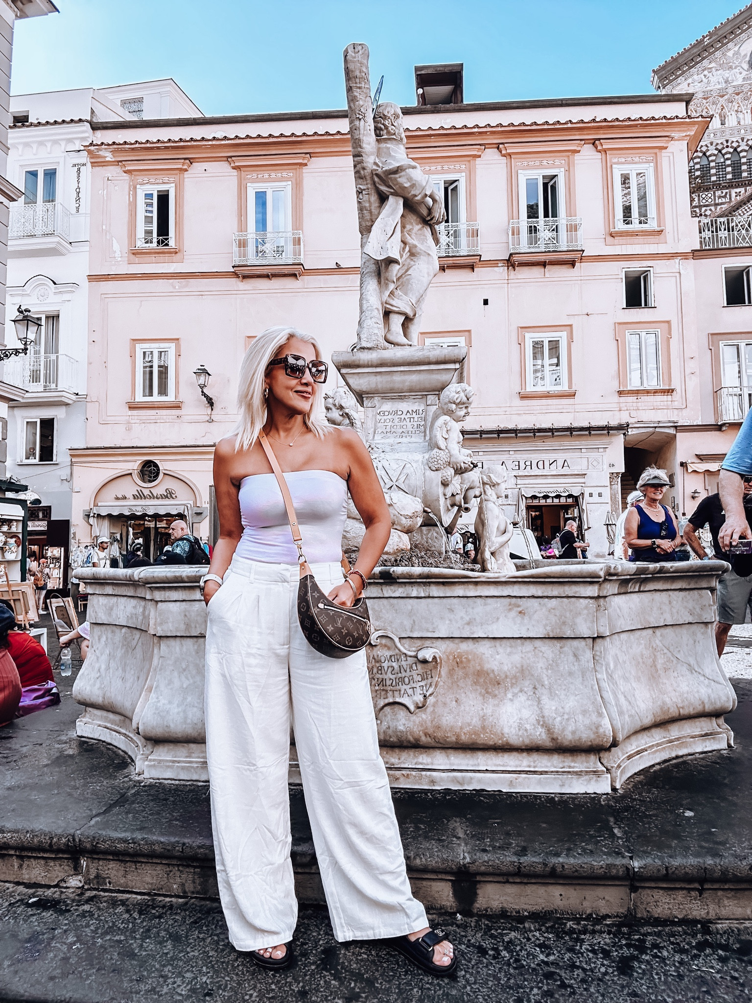Strapless, wide leg pants, wide leg Taylor pants, white pants, Louis. Vuitton loop bag, fall bag, Europe outfit, Amalfi coast outfit 

#LTKeurope #LTKSeasonal #LTKxPrime