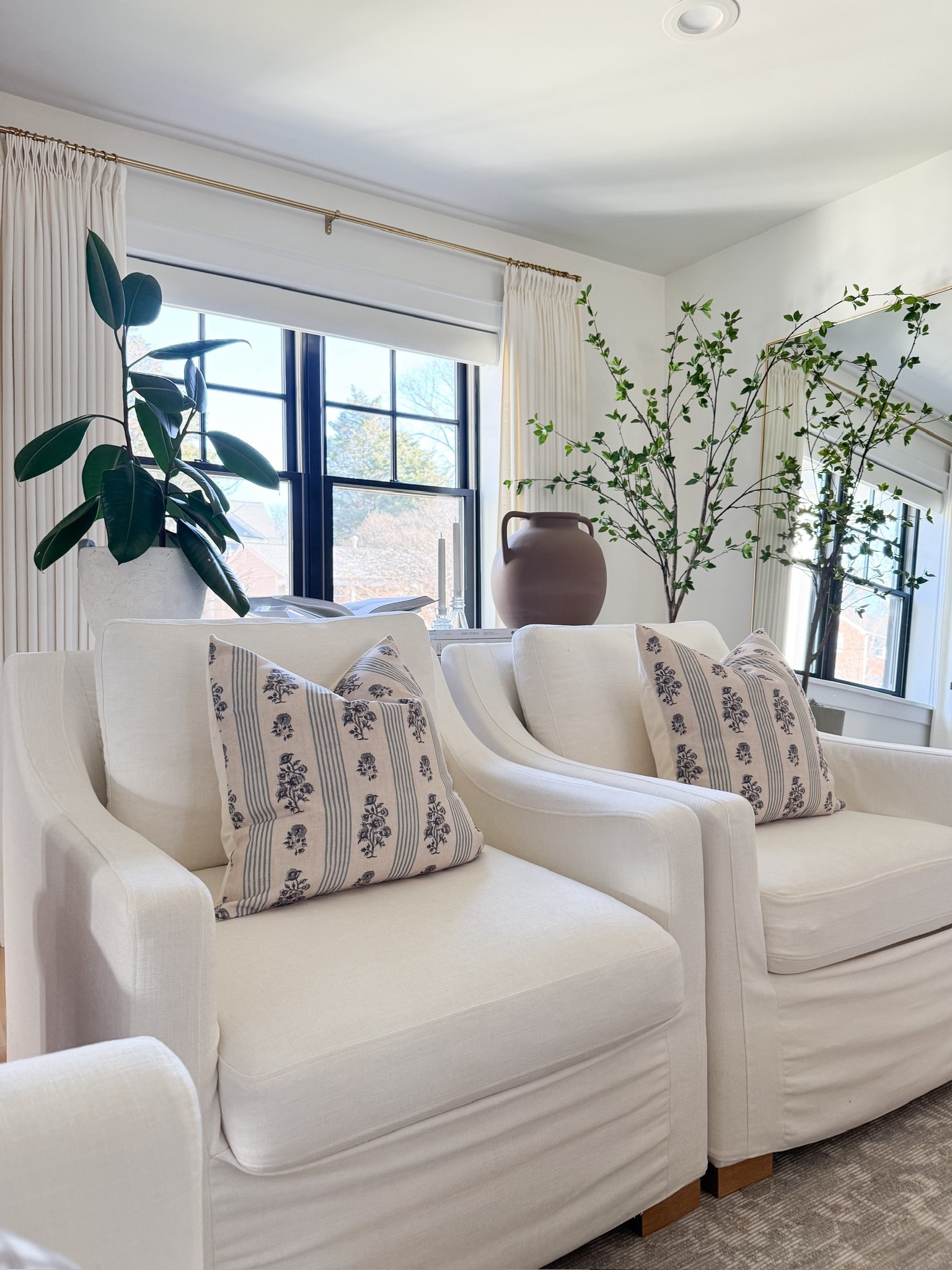 Neutral living room with pips of green. Round light wood coffee table. Home refresh inspo. 

#LTKSeasonal #LTKHome #LTKOver40