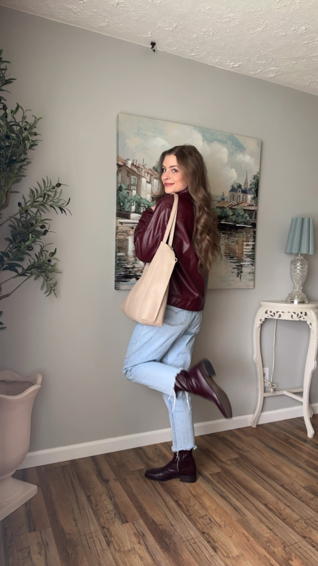 OOTD 4/7/25 

Red burgundy maroon faux leather bomber jacket, structured boxy cropped jacket, women’s leather jacket coat, trendy lather styles, high ankle leather boots, red maroon burgundy square toe boots, vintage light wash Levi denim jeans, tan leather tote bag, black ribbed turtleneck sweater, Amazon jewelry, affordable jewelry finds, charm necklace 