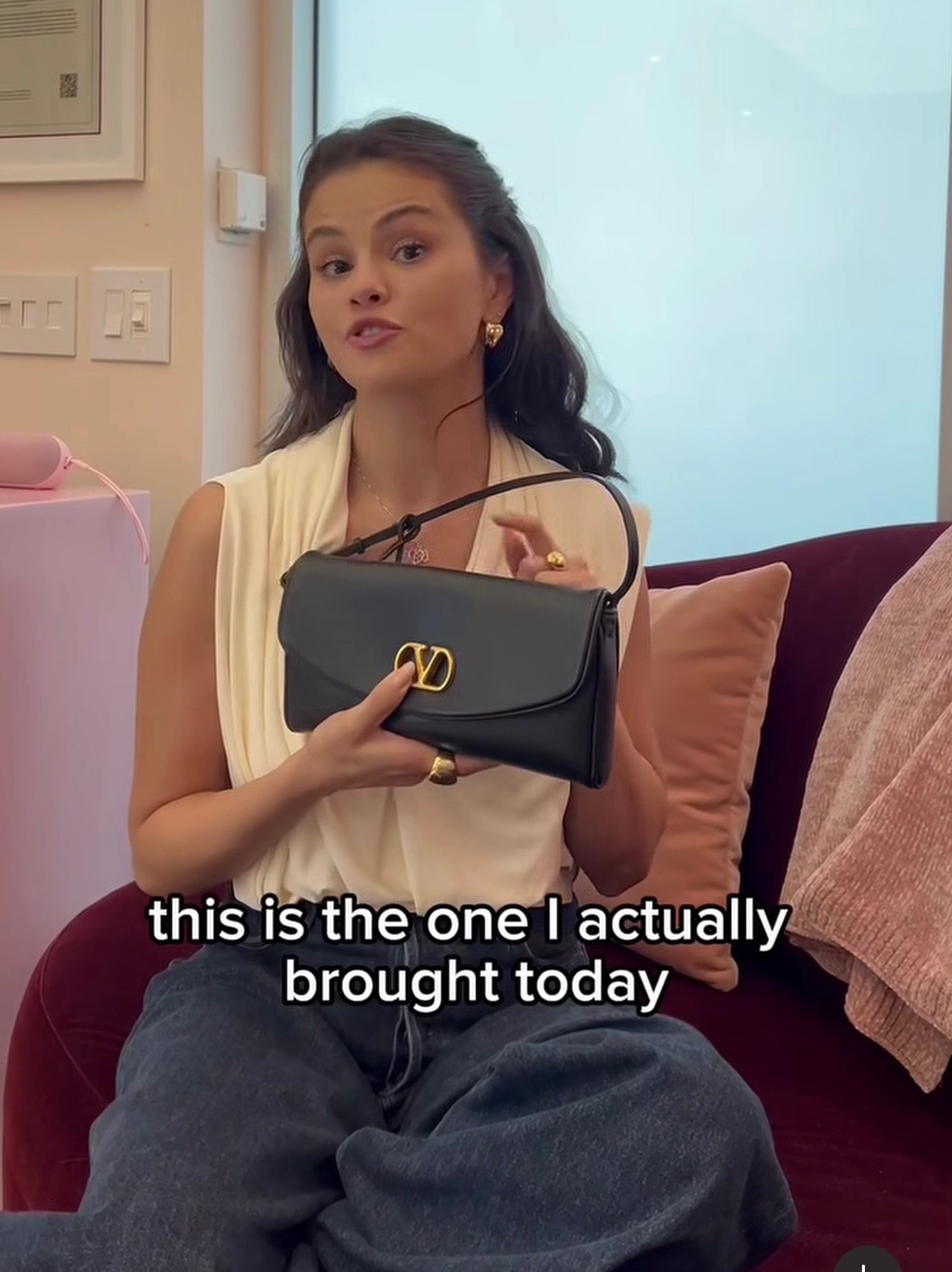 Selena Gomez new bag merges signature elegance with modern versatility in the 'DeVain' small bag. Made in Italy from smooth leather, it features a front-flap 'VLogo' emblem and a single internal compartment with a pocket, and can be carried by hand or worn over the shoulder.