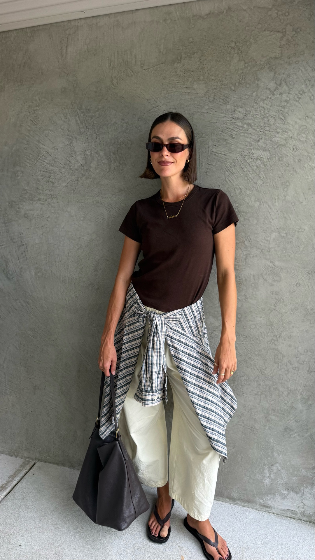 Mixing butter with chocolate brown - the perfect colour combination. I’ve tied a checkered shirt around my waist to create some interest. These pants are still my favourite barrel leg trousers. Also wearing the most perfect baby tee 

#LTKstyletip #LTKaustralia #LTKspring