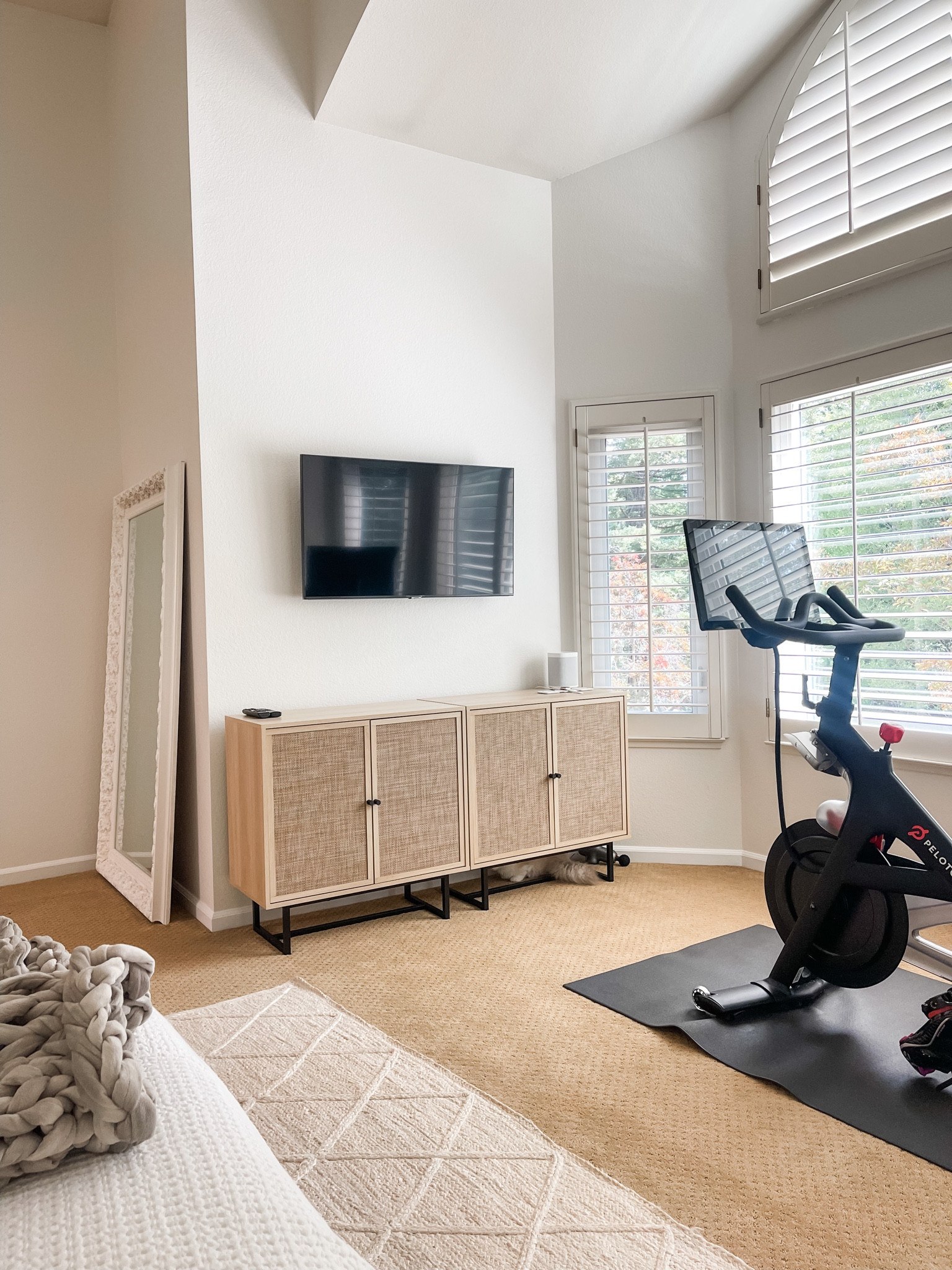 This corner of my bedroom is so much nicer with these 2 cabinets! I pushed them together so they appear as one. 😍 I store my workout stuff in one and the other has extra bedding for my bed. These are a great price and look good anywhere! 

#LTKhome #LTKFind