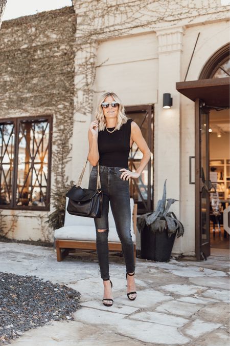 Black top, distressed skinny jeans, YSL purse, black heels and sunglasses.

#LTKstyletip #LTKFind