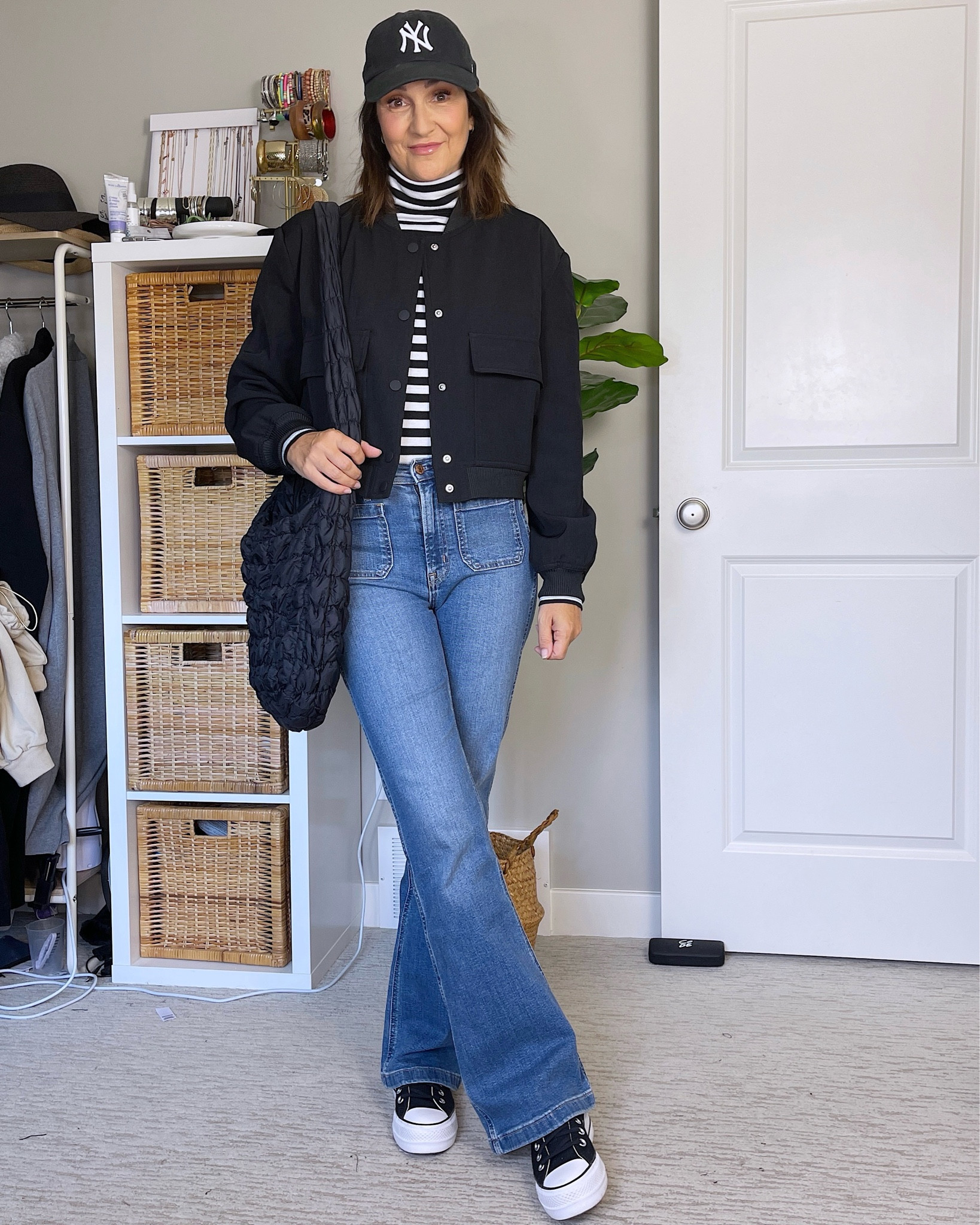 Casual black, white and denim outfit.
My striped tissue turtleneck is old but I linked several similar, they are such a good basic layer.
My cropped bomber fits tts, I sized up to M for more sleeve length (I’m 5’ 7).
My flare jeans are from last fall but still in stock and on sale! Fit tts, I’m wearing my usual 27.
Converse fit big, I suggest sizing down 1/2 size. Socks, cap and quilted bag are also from Amazon


#LTKstyletip #LTKitbag #LTKshoecrush