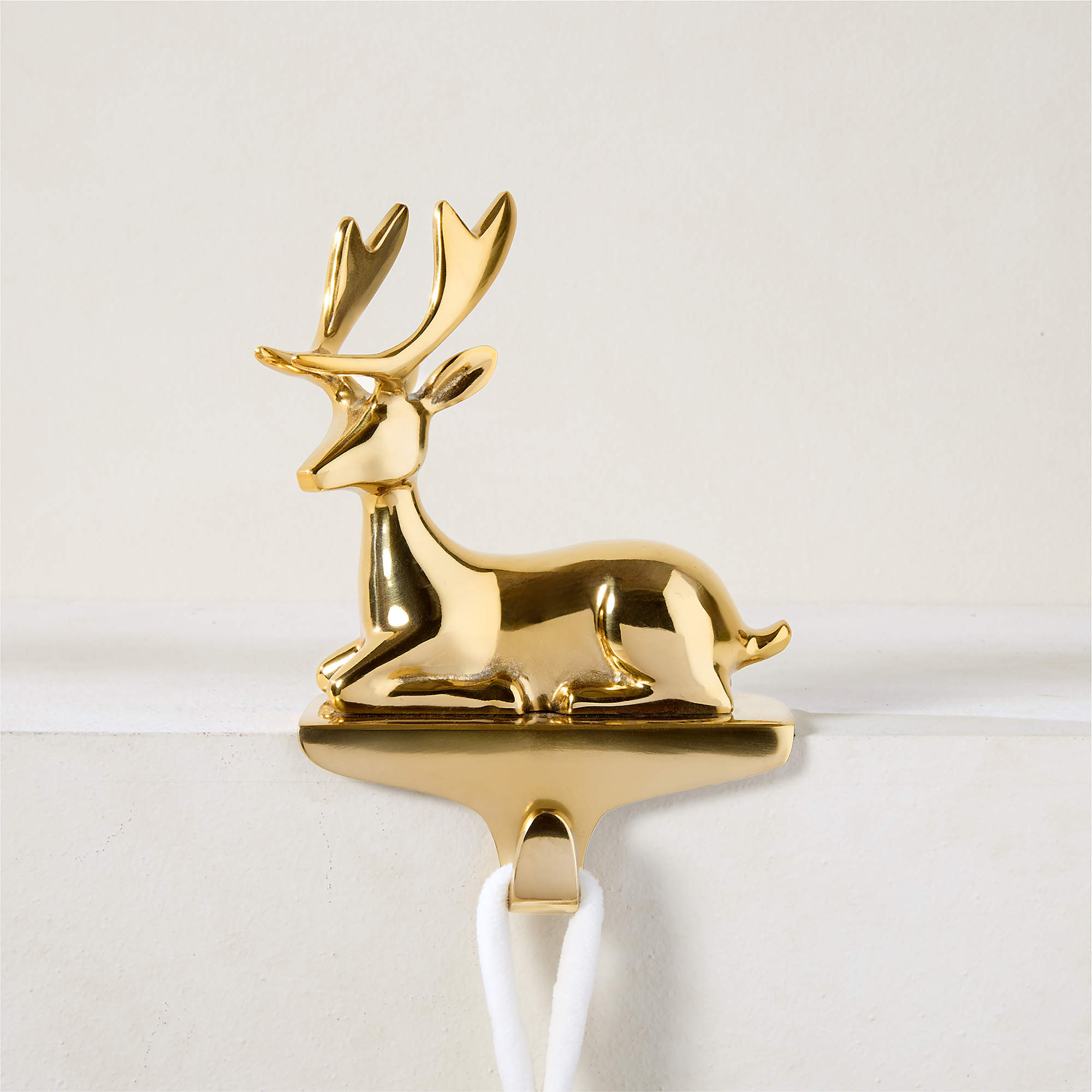 Fawn Aged Brass Cast Aluminum Christmas Stocking Holder | CB2 | CB2