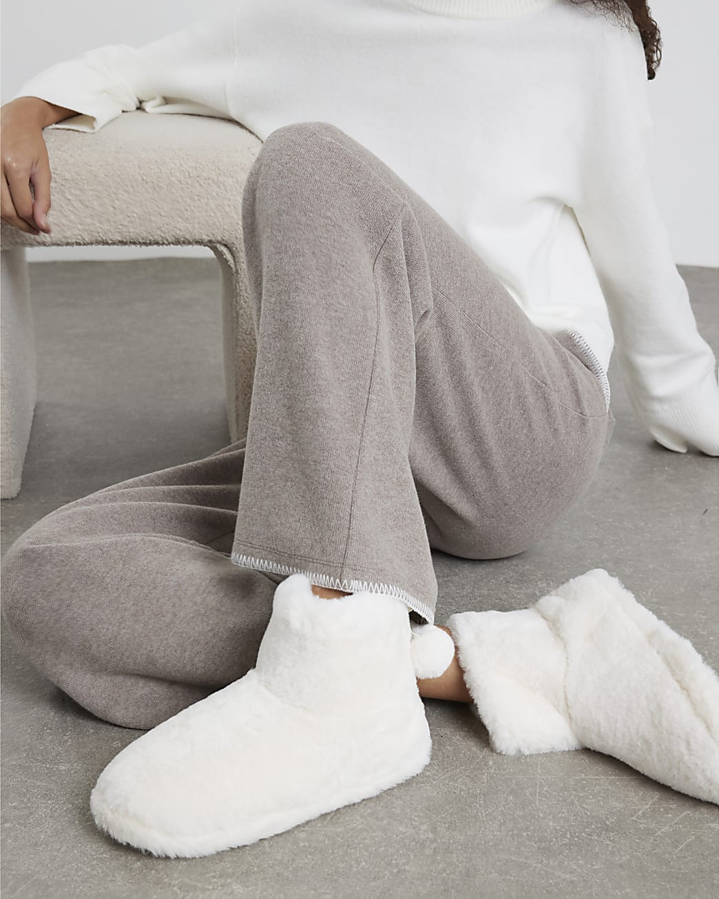 Cream Faux Fur Bow Pom Pom Boot Slippers | River Island UK & IE