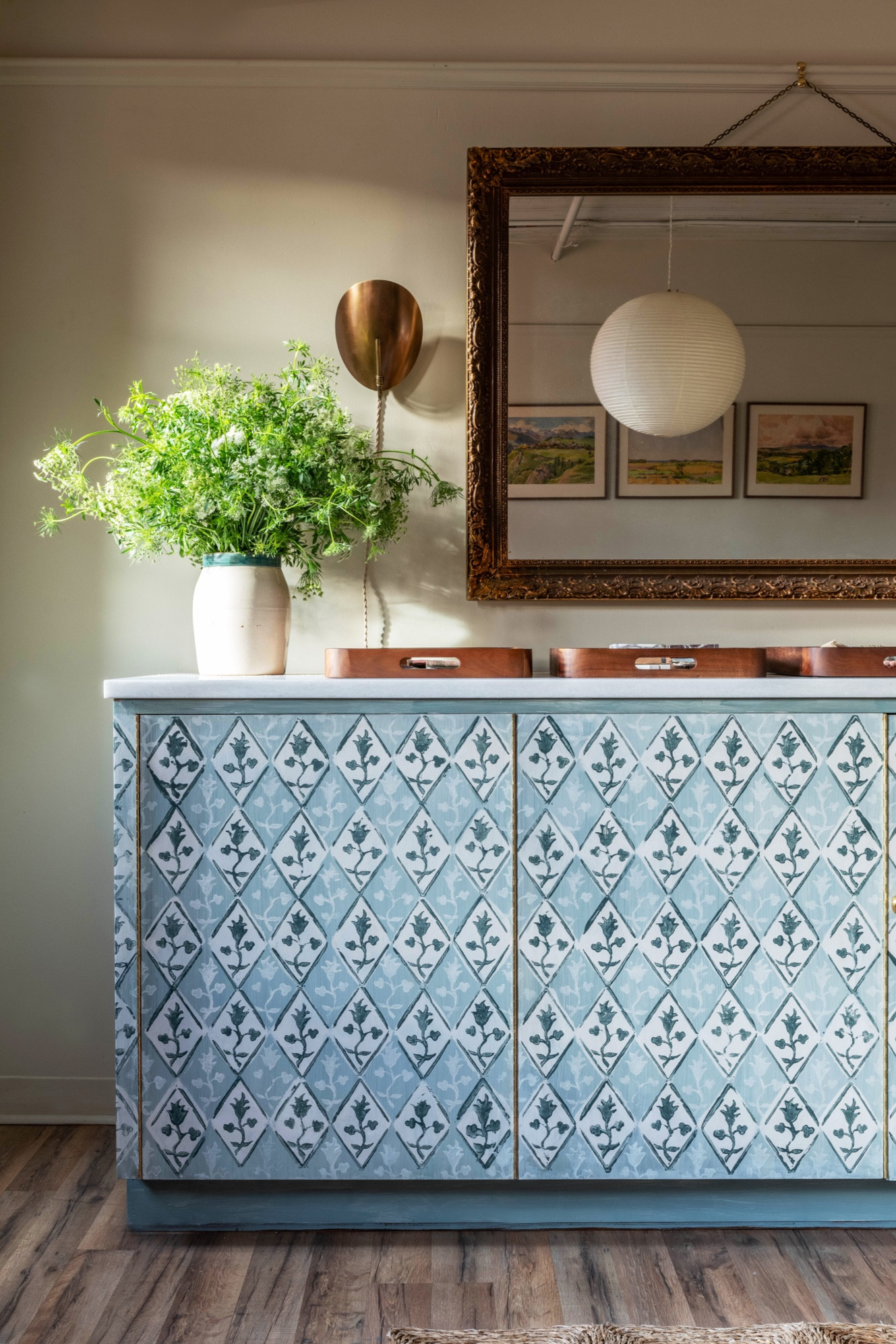 Painting this cabinet took months but I’m so happy I spent the time doing it because I love the final result! Check out the linked supplies I used to create the stamps for the floral pattern motif. #LTKDIY #LTKhome #LTKhomedesign #LTKinteriordesign #studiolaloc #studiolalocinteriors