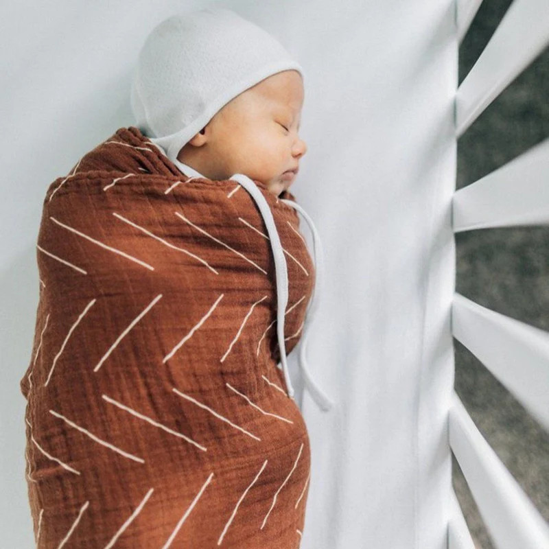 Rust Mudcloth Muslin Swaddle Blanket | Project Nursery