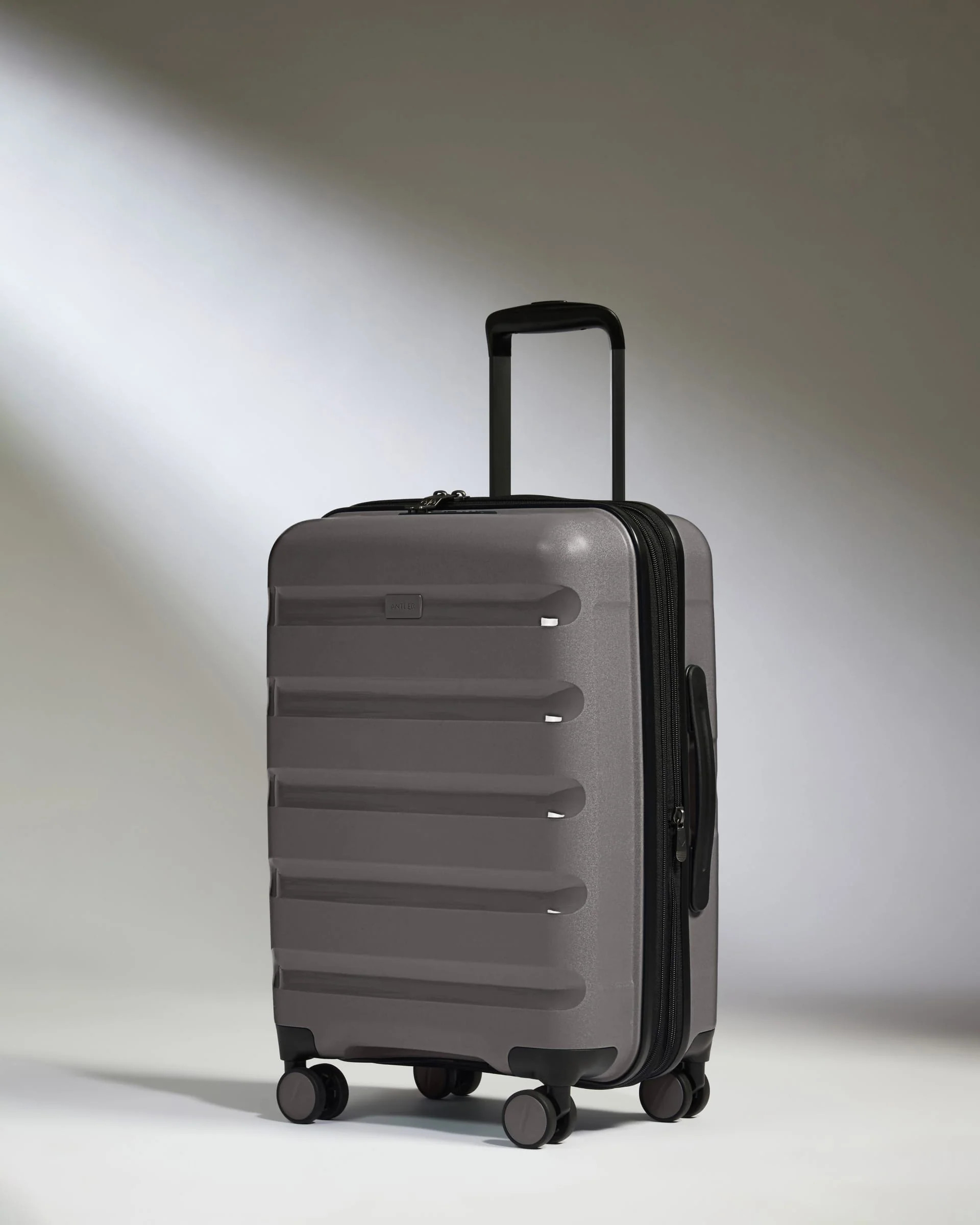 Expandable Cabin Suitcase in Gloss Grey - Logo Stripe | Lightweight Hard Shell Luggage | Antler UK