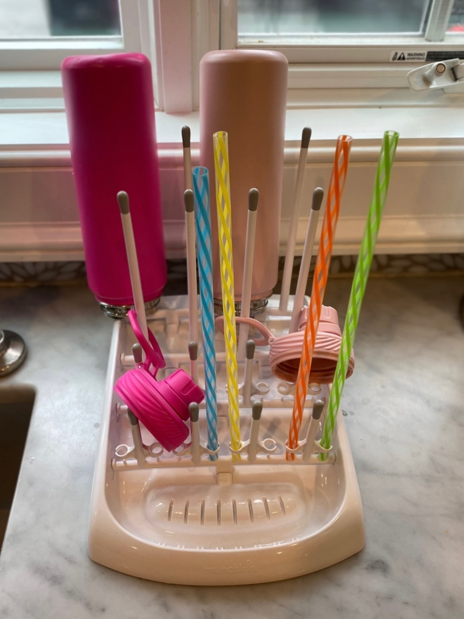 This is the best tool to dry water bottles after washing them out. I love how the angle pools water at the bottom so the water bottles (and straws!) can actually get totally dry. Plus, it collapses flat when not in use (though ours is always in use!).

#LTKhome #LTKfamily #LTKunder50