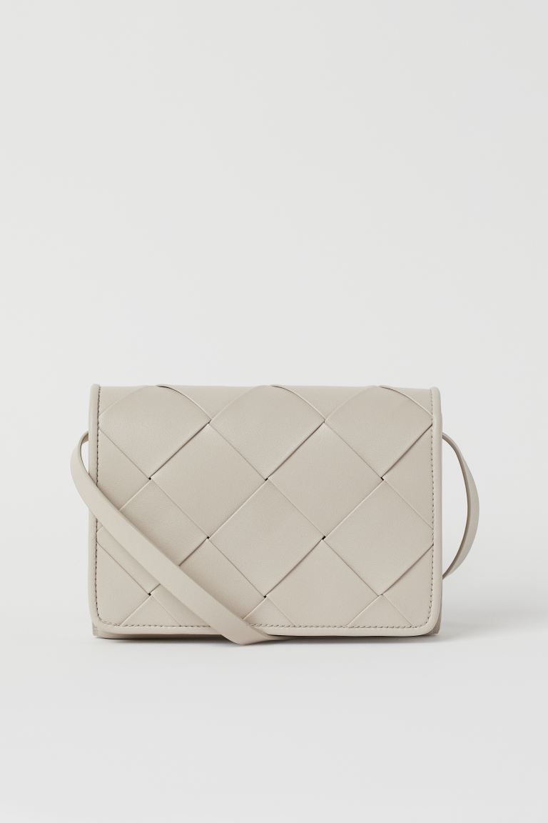Small shoulder bag in faux leather with a narrow, adjustable shoulder strap. Braided flap with co... | H&M (US + CA)
