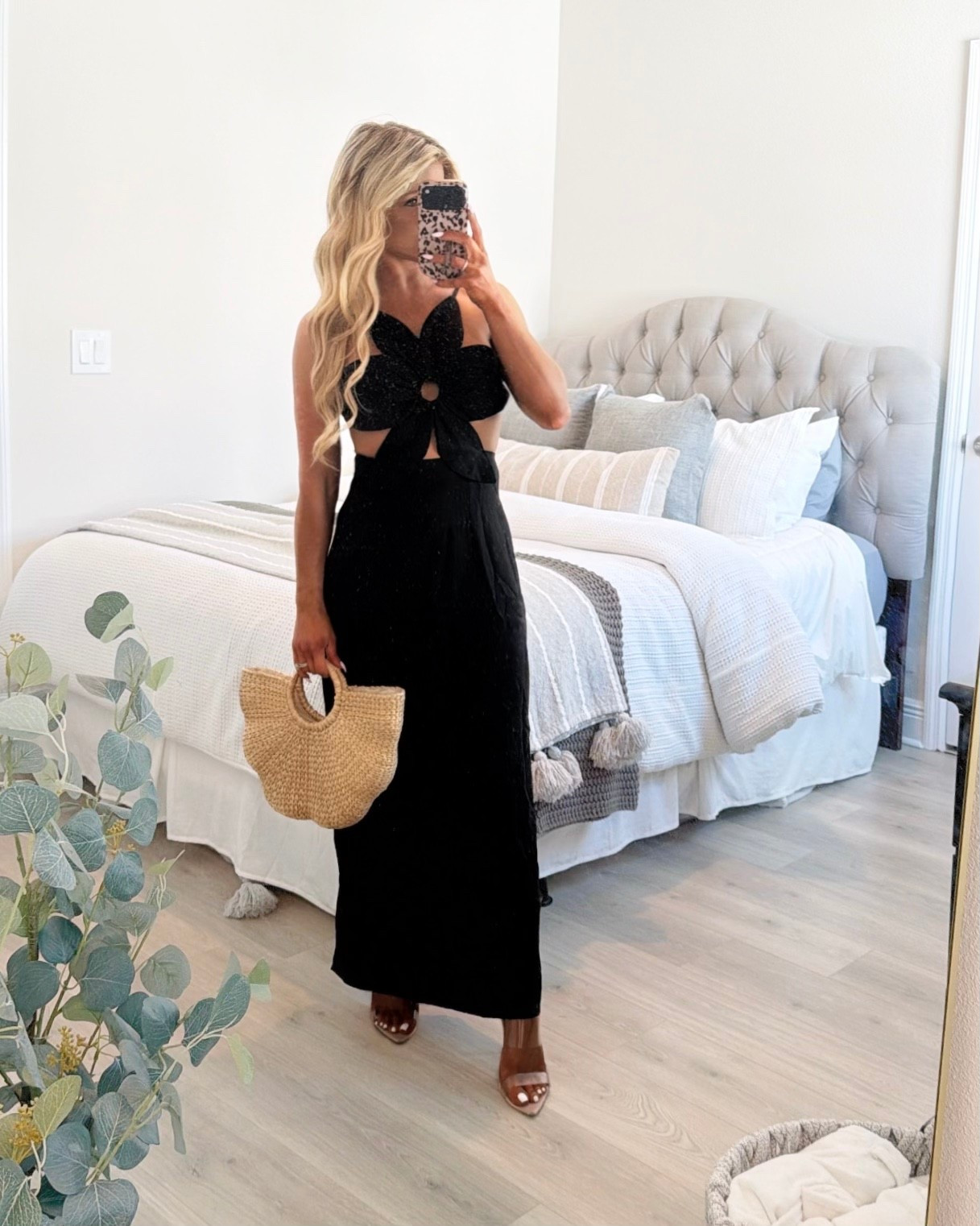 Black Maxi Dress with a floral appliqué design + open back / cut out detail that makes the perfect vacation dress, date night dress, or resort dress. 

Black dress, summer dress, resortwear 2026 

#LTKTravel #LTKootd #LTKSeasonal