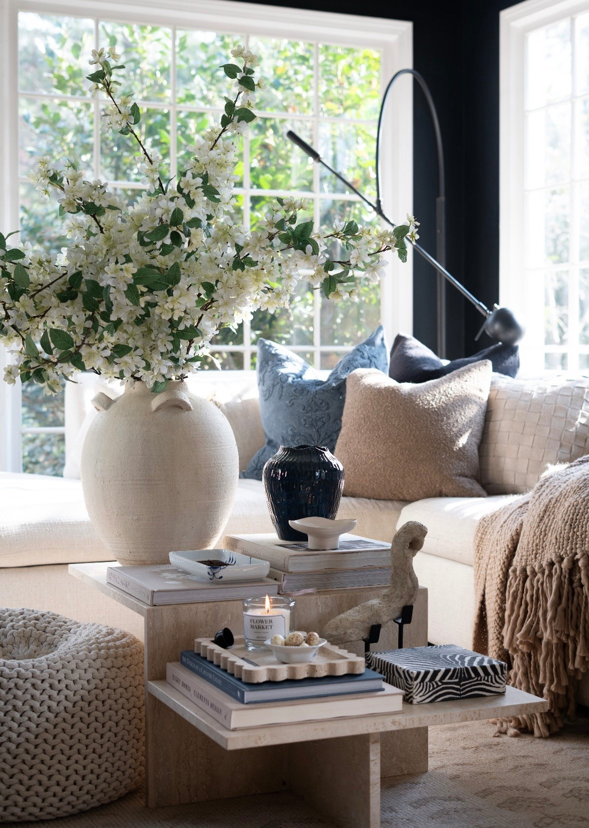 OMG you guys I cannot even handle how dreamy this space feels. The natural light pouring through these big windows, the oversized ceramic vase filled with spring blossoms, and the soft neutral palette are giving the coziest elevated living room vibes. I’m obsessed with the layered coffee table styling, stacked design books, warm textures, and subtle blue accent pillows. This is officially my favorite cozy corner for coffee, a good book, and soaking up all the spring sunshine. Neutral living room decor, marble coffee table styling, and fresh floral arrangements all in one perfect moment. 

 

#LTKSaleAlert #LTKSeasonal #LTKHome