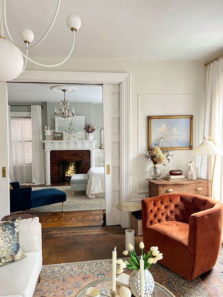 Living room- chandelier, floor lamp, swivel chair, rug, vase, coffee table 

#LTKFind #LTKstyletip #LTKhome