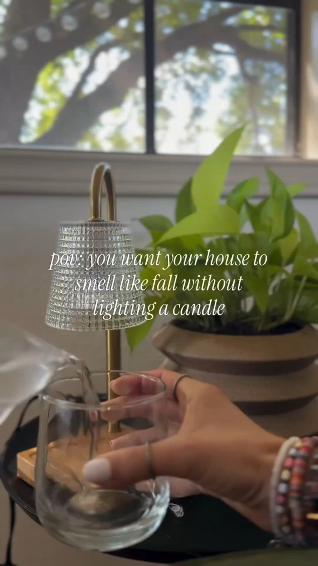 Your candle warmer isn’t just for candles. 👀 I loveeee to use mine as a mini simmer pot. It’s non-toxic, smells amazing, and you’ve probably already got all of the ingredients in your house! 

Here are my tips:
- Use a glass cup or bowl that is tall enough to come near the bulb (it’ll give off a stronger scent)
- Start with hot water! Heat in the microwave or in a kettle. 
- My favorite recipe is: a few orange and apple slices, a cinnamon stick, and about a tablespoon of cloves. 

It smells like the perfect fall afternoon! 🥰 If you want a link to the candle warmer I use, along with a few of my other favorite simmer pot recipes and tips, comment SIMMER and I can dm it to you!