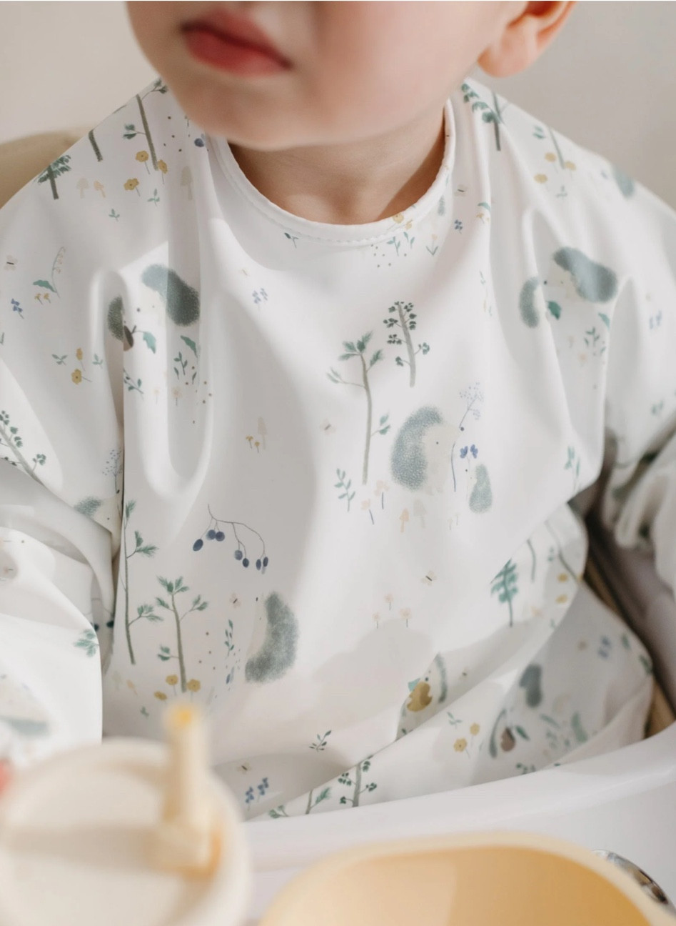 This waterproof bib is for 6+ months once they start consuming more than milk. It’s super useful though because kids make an absolute mess when they eat so this covers a lot more than just a traditional bib and keeps their clothes clean! 

*I got the hedgehog print which is currently sold out but I’ve linked another print I think is really cute!🦔 