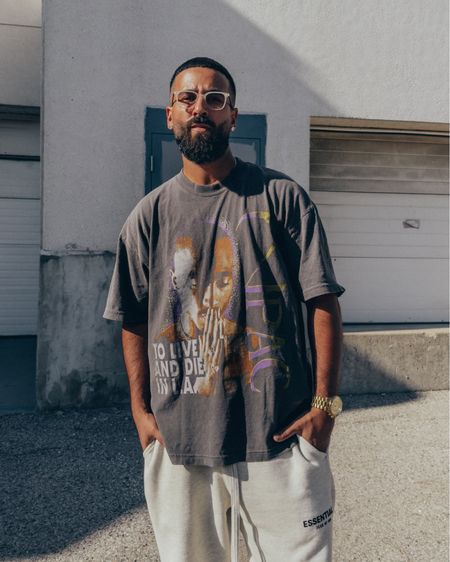 SIXTHREESEVEN 2pac To Live and Die in LA T-shirt in ‘Washed Black’ (size XL). ESSENTIALS Relaxed Sweatpants in ‘Light Oatmeal’ (size M). FEAR OF GOD 7th Collection Duck Boots in ‘Black’ (size 41) and Socks in ‘Cream’. FEAR OF GOD x BARTON PERREIRA glasses in ‘Matte Taupe’. A relaxed and elevated men’s look that’s great for a day of running errands. Size up by 1-2 size for an oversized fit in the tee. 

#LTKfindsunder100 #LTKmens #LTKstyletip