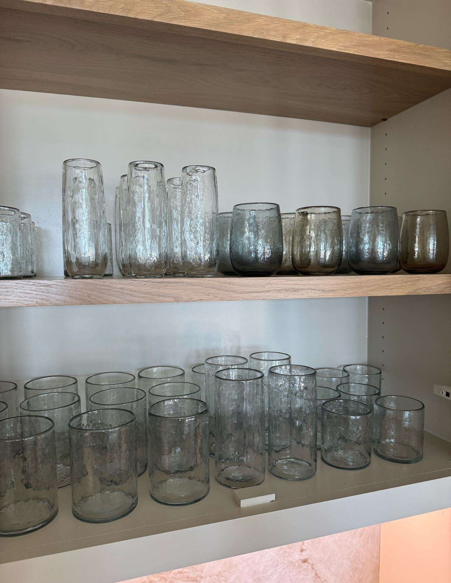 My hammered glassware is stunning and they look beautiful in open glass cabinets. We had these on our wedding registry and they’ve been siting in boxes since we got them because we did not have cabinet space in our condo. It was so fun unboxing them for the first time and putting them on display! I have all of them except for the water goblets.  

Since we got them, they also have stemmed wine glasses and glasses that are tapered with gold rim! #glassware #kitchenware

#LTKHome