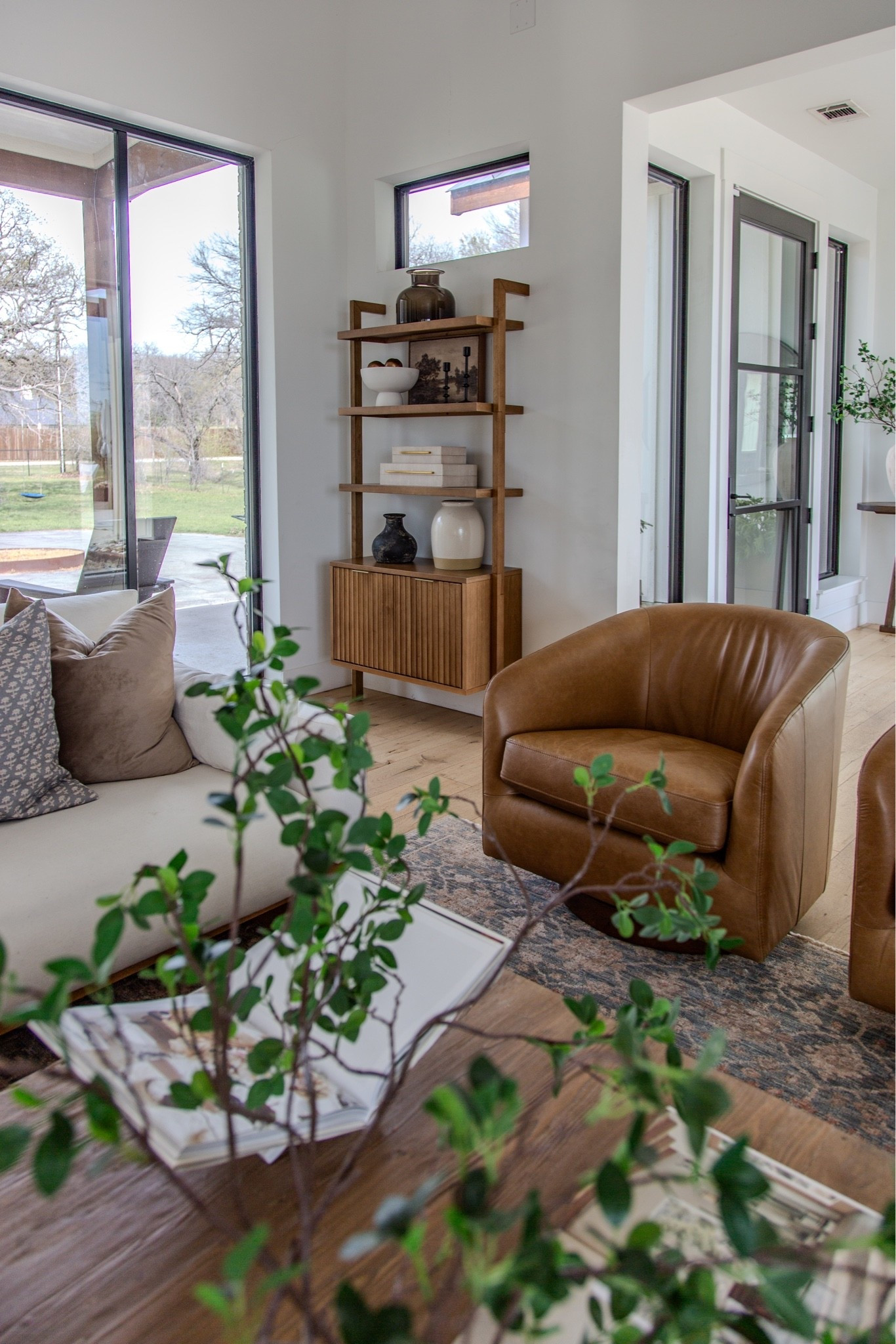 One of my favorite views in our home 🤍

This corner perfectly mixes warm wood tones, rich leather, and soft neutrals. The Nathan James bookshelf adds the prettiest styling moment, the leather swivel chairs from Wayfair are as comfortable as they are beautiful, and the vintage-inspired rug grounds the whole space with so much warmth and character. We finished it off with our white Castlery sofa, which has held up so well and works with every season of styling.

If you love organic modern decor, warm neutral interiors, leather accent chairs, open shelving styling, vintage-inspired rugs, cozy living rooms, and timeless furniture pieces, I’m linking everything here!

organic modern living room, leather swivel chairs, Wayfair rug, Nathan James bookshelf, Castlery sofa, neutral home decor, warm modern interiors, living room styling, designer home finds, cozy living room ideas, vintage inspired rug, modern farmhouse decor, living room furniture, shelf styling ideas, home decor inspiration

#LTKdayinmylife #LTKHome #LTKSaleAlert