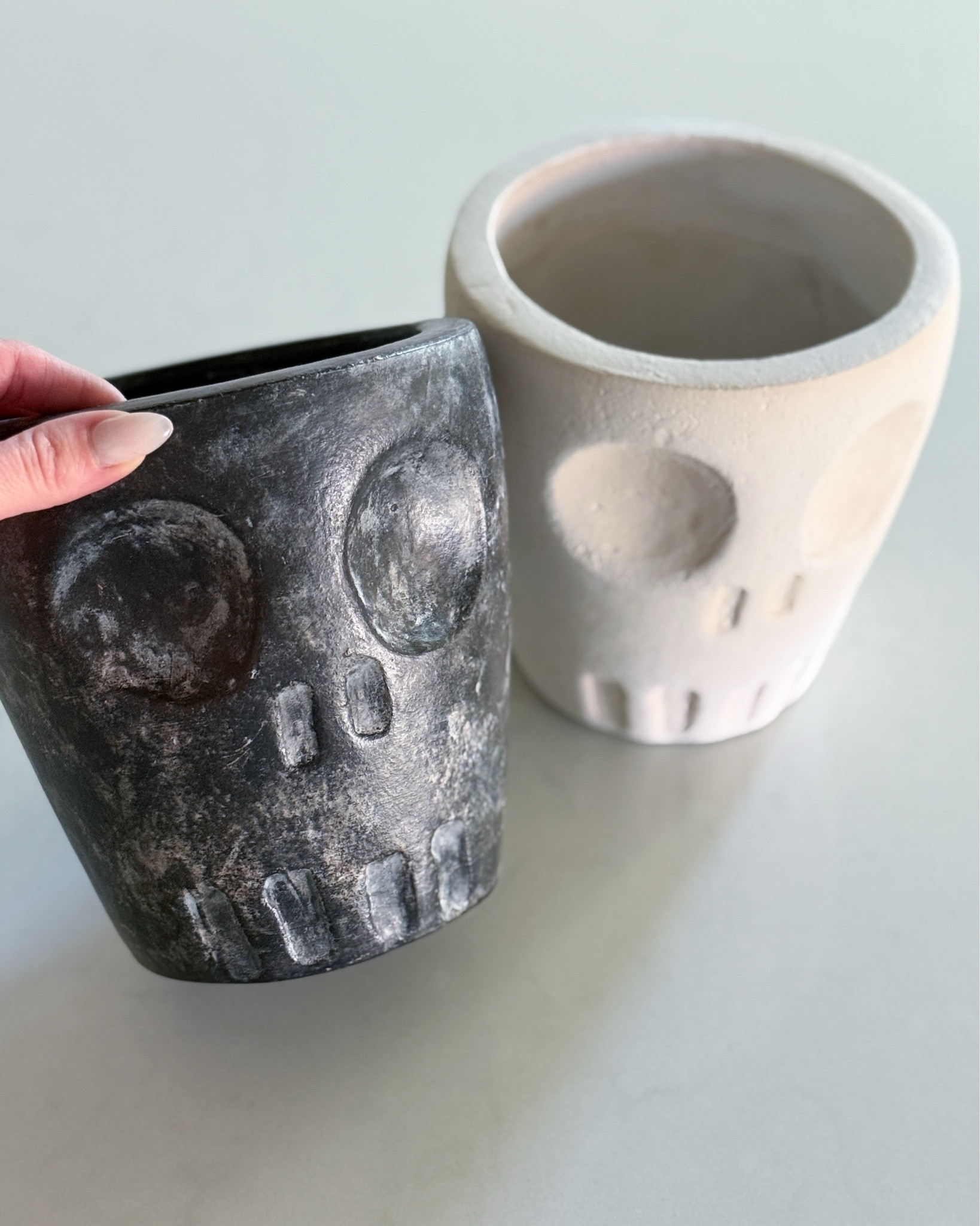 How cute are these spooky skeleton cachepots?! I had to get both the white and the black, because obviously I’m styling them in more than one spot. Perfect for Halloween, but honestly you could rotate their faces to the back to stay out all season long. So good for kitchen counters, shelves, or an entry table moment with a moody candle or mums. Linking both before they sell out!

Halloween home decor - skeleton planter - spooky home accents - skull flower pot - neutral Halloween styling - black and white Halloween decor - modern Halloween decorations - fall shelf styling - Halloween centerpiece ideas - moody fall decor - Halloween cachepot - spooky cute Halloween - Halloween decor 2025 - skull themed decor - Halloween planters - Halloween flower pots - indoor Halloween styling - Halloween home ideas - chic Halloween decorations - skull home accessories

#LTKSeasonal #LTKFamily #LTKHome