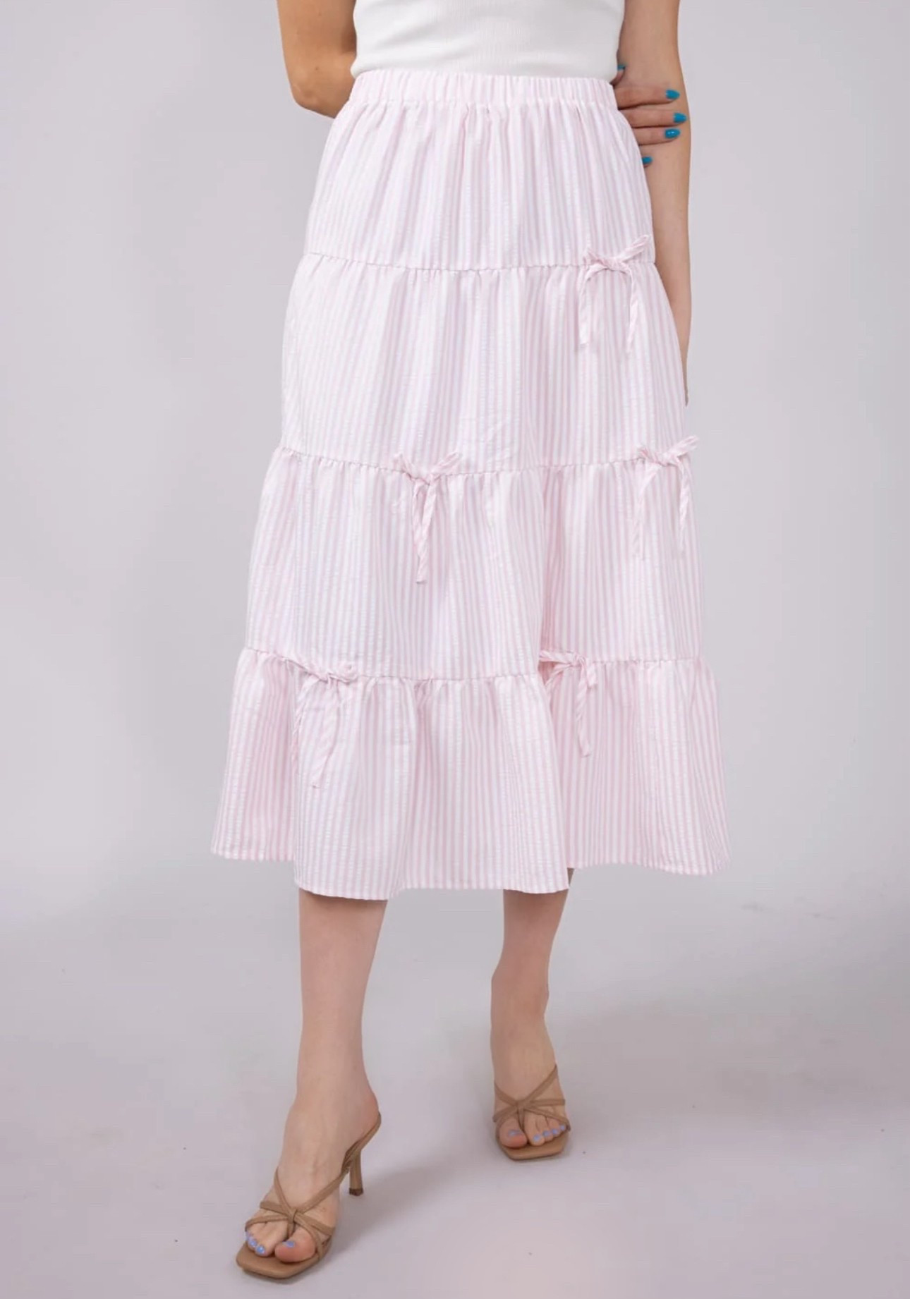 This adorable pastel pink and white striped midi skirt from Glik's is perfect for summer time! The tiny bow accents are beyond adorable! 🎀

Midi skirt, pastels, summer style, summer ootd, summer outfit inspo, summer fashion, summer outfit, summer outfit idea 

#LTKFindsUnder50 #LTKSummerEdit