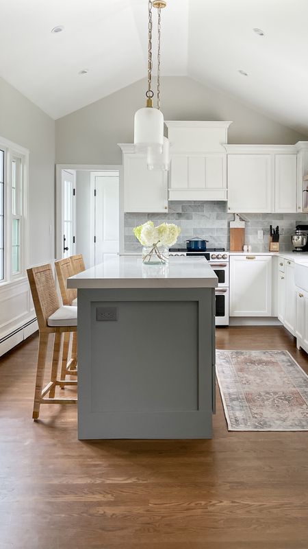 Beautiful clean kitchen with white cabinets, Serena & Lily Rattan barstools, light fixtures, coastal style home decor

#LTKfamily #LTKhome