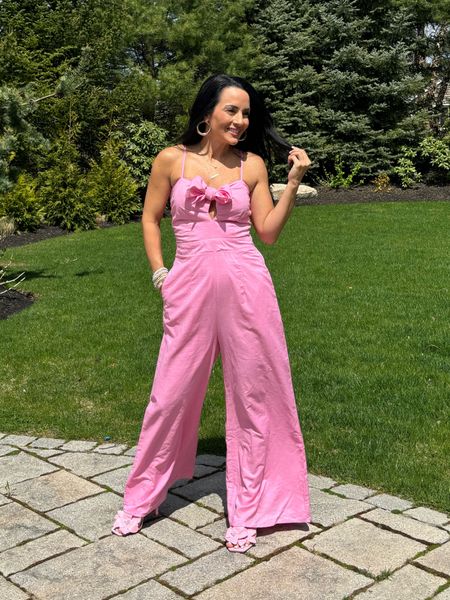 Pink linen jumpsuit with tie front detail. I am wearing a size extra small. I finish the look with target pink flower heels.


#LTKparties #LTKstyletip #LTKfindsunder100