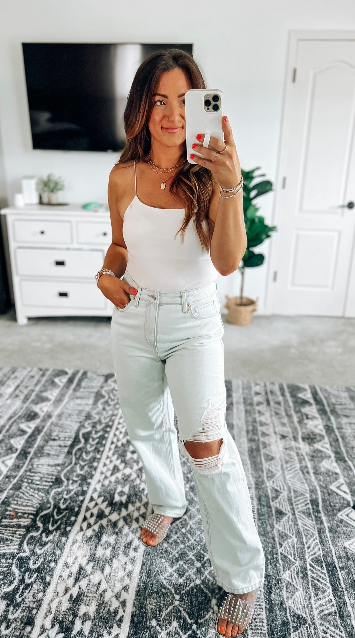 Cutest spaghetti strap bodysuit! Did the small, but would prefer a medium. Jeans also on clearance and true to size. I’m normally a 7.5 and sized up to the 8 in the sandals 

#LTKsalealert #LTKstyletip #LTKSeasonal