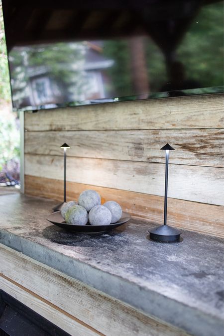 Outdoor/indoor battery operated lamps. These lights are modern and fun! 
The fire pit spheres make great bowl filler for modern home decor! 

#LTKSeasonal #LTKFindsUnder50 #LTKHome