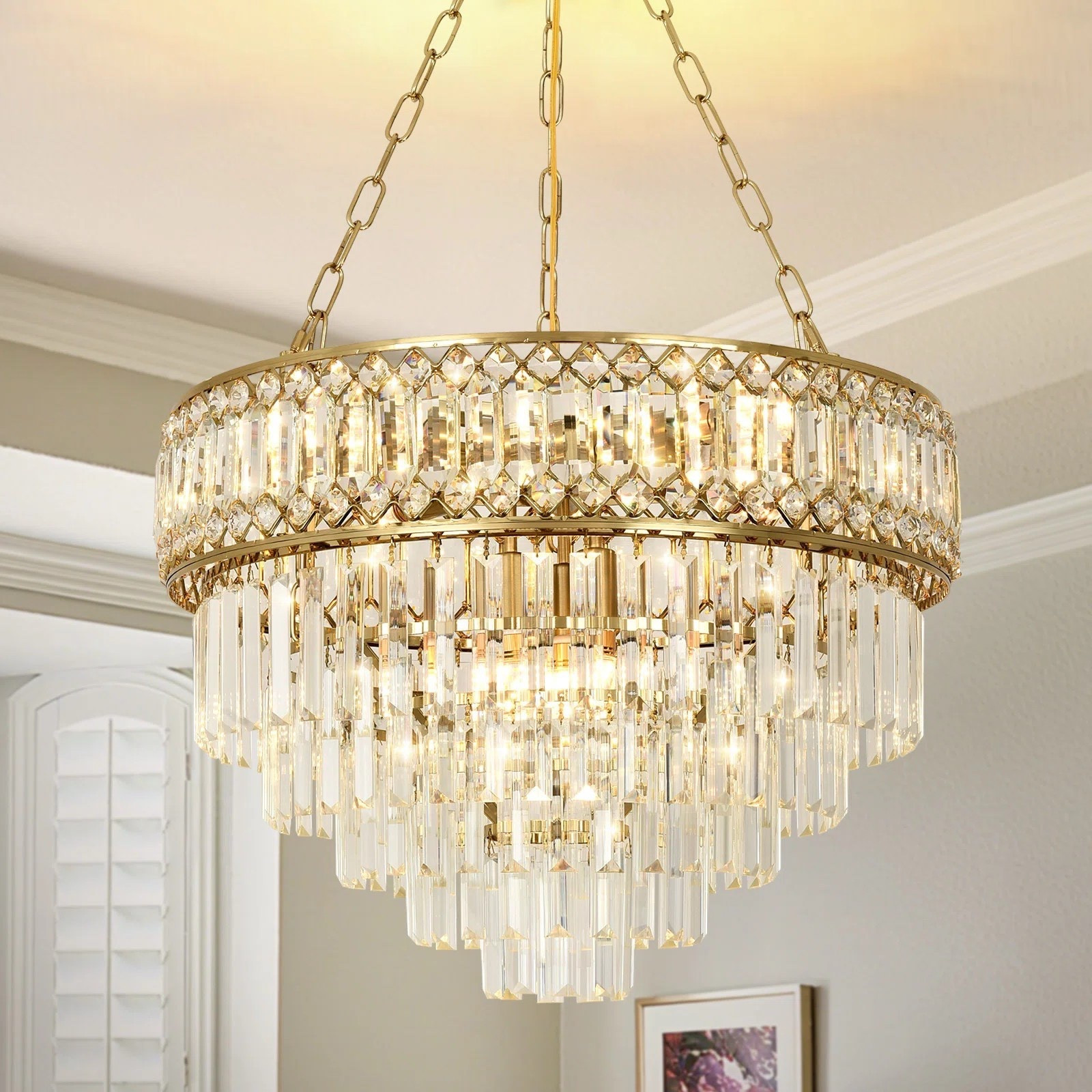 Bring hotel-level elegance home with this crystal tiered chandelier — the ultimate statement lighting piece. This crystal chandelier is ideal for small living spaces, including foyer spaces, dining rooms, and bedrooms. ON SALE and under $250.

Keywords: Crystal chandelier, ceiling chandelier, modern crystal chandelier, living room chandelier, dining room chandelier, bedroom chandelier, wagon wheel chandelier, luxury chandelier, luxury living

#LTKSaleAlert #LTKSeasonal #LTKHome