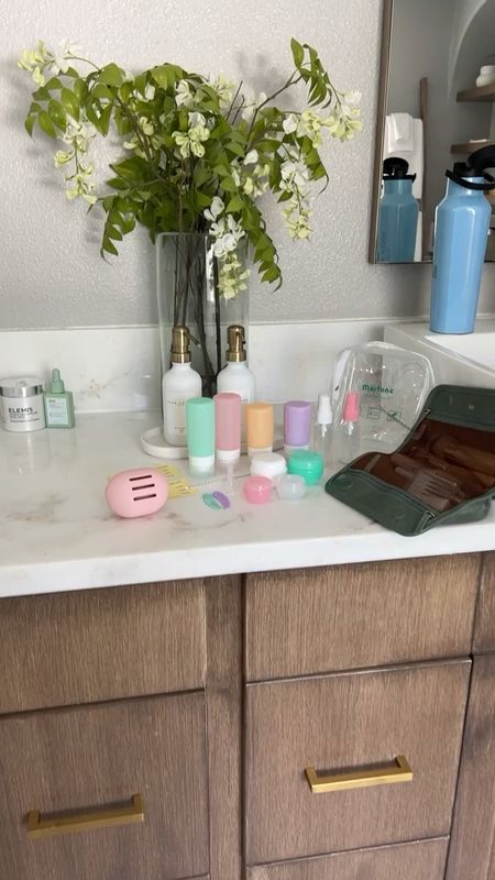 My favorite travel toiletry set. These are the absolute best refillable travel bottles. There are 16 pieces and it has bottles for everything from hair care to skincare and more! I also love that it comes with a funnel and scrapers to make filling them an ease.

The tubs have inner tops to help prevent leaking and the silicone bottles allow you to get every ounce of product out so there is zero waste. It even comes in the clear pouch making it easy to pull out your toiletries at security for the international countries that require you to have your bottles in a clear pouch. 

#ltktravel 

#LTKunder50 #LTKFind #LTKfamily