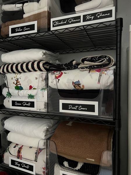 Linen closet organization. This 5 tiered shelf comes with shelf liners. The bins are stackable. The labels were made with a cricut. #meandmrjones 

#LTKhome #LTKfindsunder50 #LTKfindsunder100