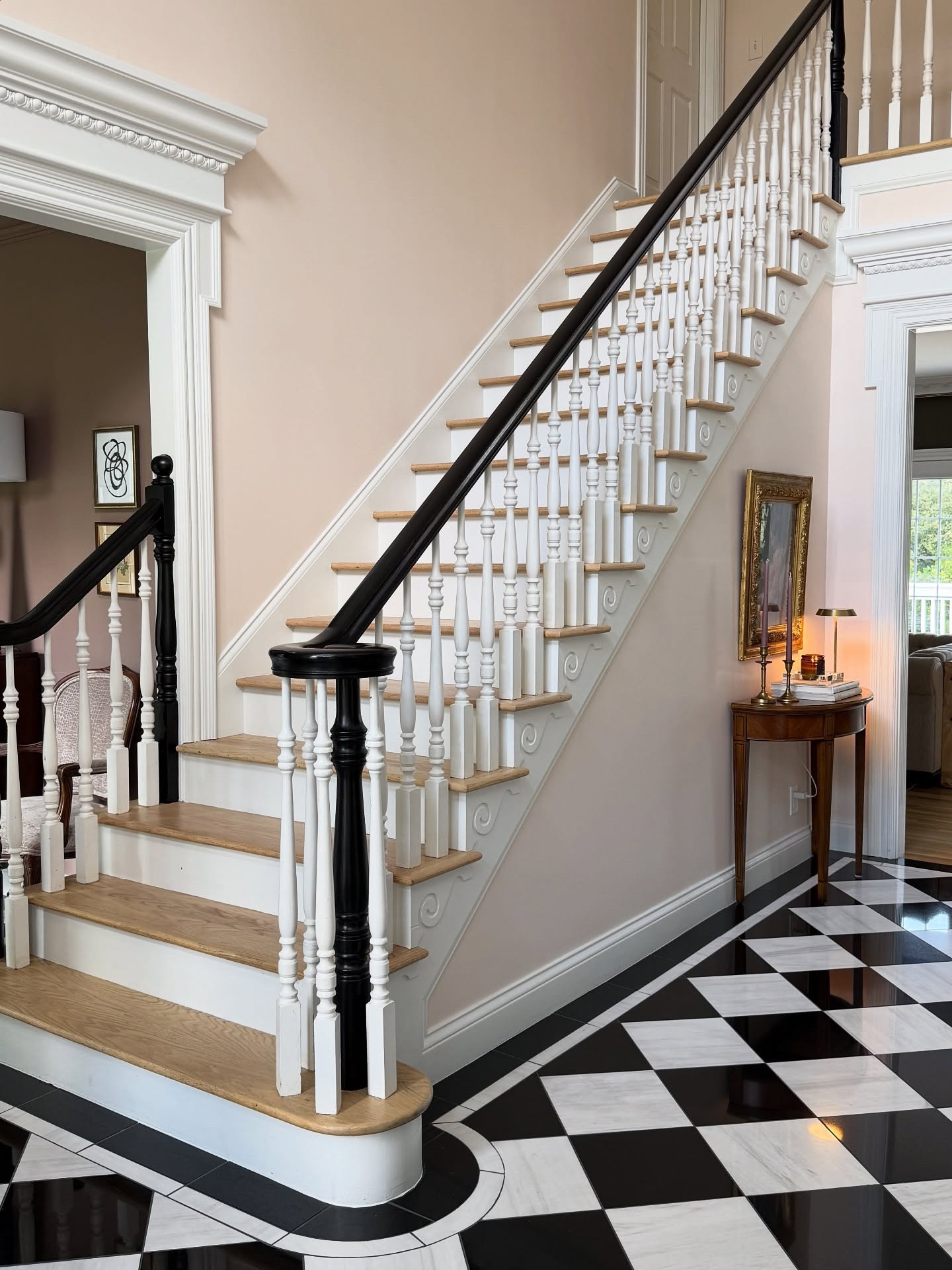 I worked with my paint swatches and ChatGPT to get the perfect peachy pink for our foyer! I can’t believe how the paint color and adding crossheads elevated this space!

I’m considering adding a stair runner and brass stair rods. What do you think?

Paint color is Sherwin Williams Teasing Peach and trim is SW Pure White 🍑

#themonarchcolonial