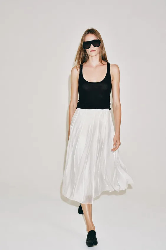 ZARA WOMAN COLLECTIONMidirock mit mittelhohem Bund aus einem Lyocell-Mischgarn. Ausgestellter Sau... | Zara DE