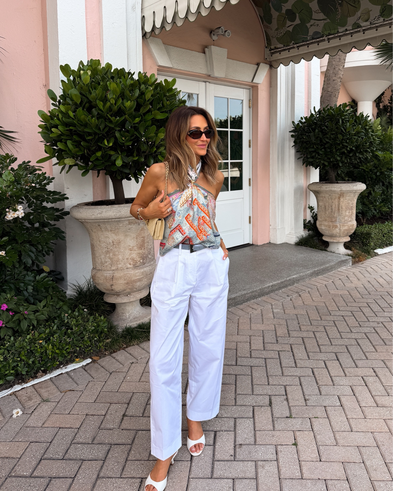 A silk scarf and white trousers 💕🤍 Palm Beach meets St. Tropez! 
Comment PALM BEACH and I’ll send you links! 

Wore my Hermes scarf as a top for dinner! I love how you can extend your wardrobe with a beautiful scarf, pants are on sale. Very chic and easy to wear with fiats or kitten heels

#LTKootd #LTKgrwm #LTKSeasonal
