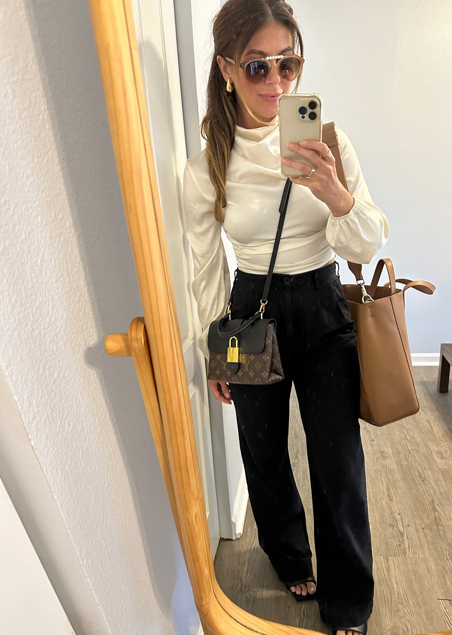 This Amazon blouse has been good to me and is still holding up! Love the sati. Sheen and cropped length but runs small and very short. I’m wearing an XS and I have a short torso but it still fits above my natural waist. I recommend wearing with pants or a skirt that is high waisted. The Ellery pant will continue to be wardrobe staple for work and weekends! 

#LTKfindsunder100 #LTKSale #LTKfindsunder50