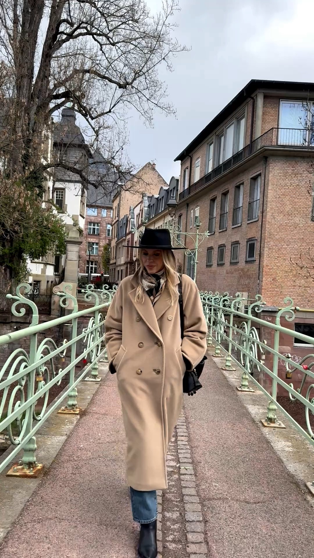 Spring outfit, camel coat, @Janessa Leone black wool hat, silk scarf, European vacation look, travel outfit

#LTKTravel #LTKSeasonal #LTKOver40