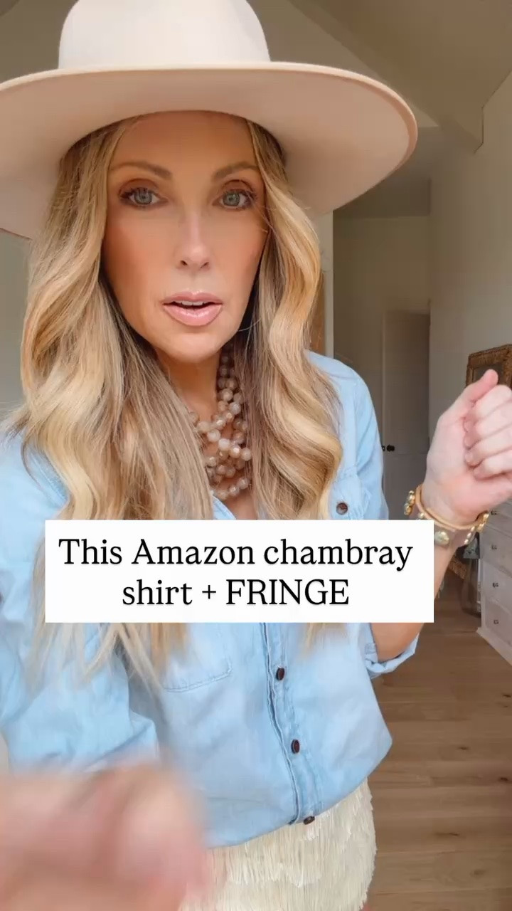 Adding a little fringe is one of the easiest ways to transform an everyday outfit into the perfect country concert look. I love pairing a relaxed chambray shirt with a fun statement bottom for an effortless western-inspired outfit