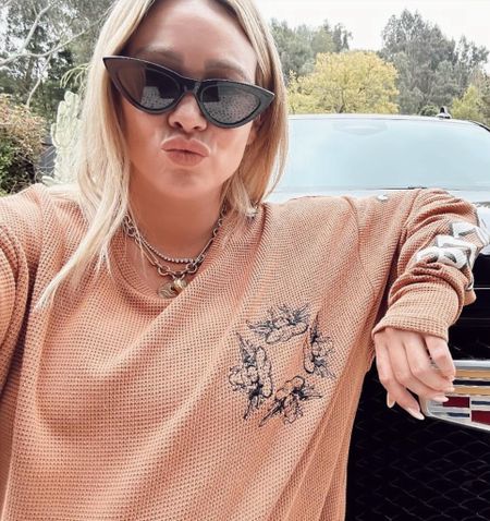 Shop Hilary Duff's long sleeve thermal graphic T-shirt cat eye oversized sunglasses #HilaryDuff #CelebrityStyle

#LTKstyletip #LTKFestival #LTKsalealert