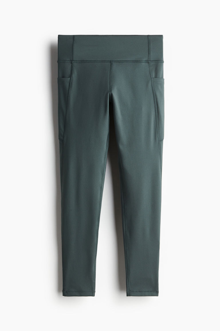 H & M - Pocket-detail sports leggings in DryMove - Green | H&M (UK, MY, IN, SG, PH, TW, HK)