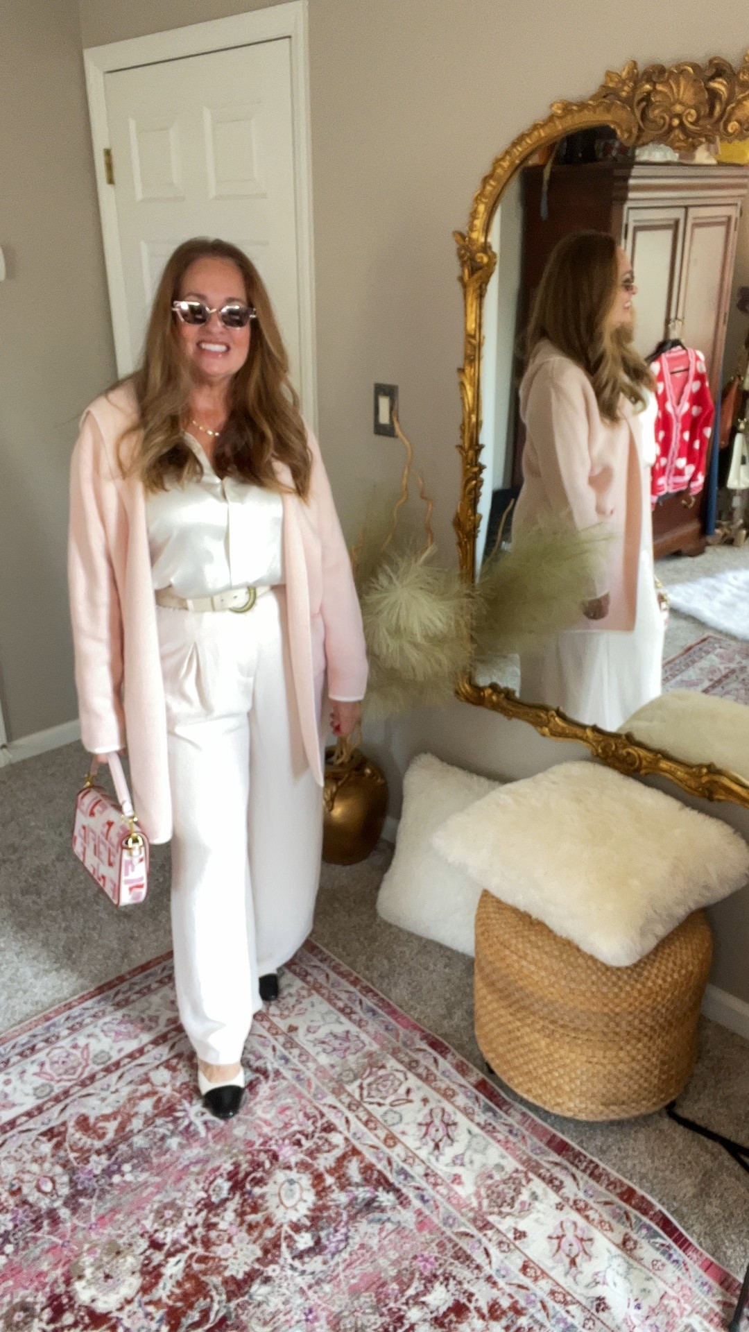 Baby whisper pink long elegant cardigan with ivory trim. Perfect for cold weather and work wear. It has a very feminine style that looks fabulous when paired with winter white.

#LTKootd #LTKgrwm #LTKWorkwear